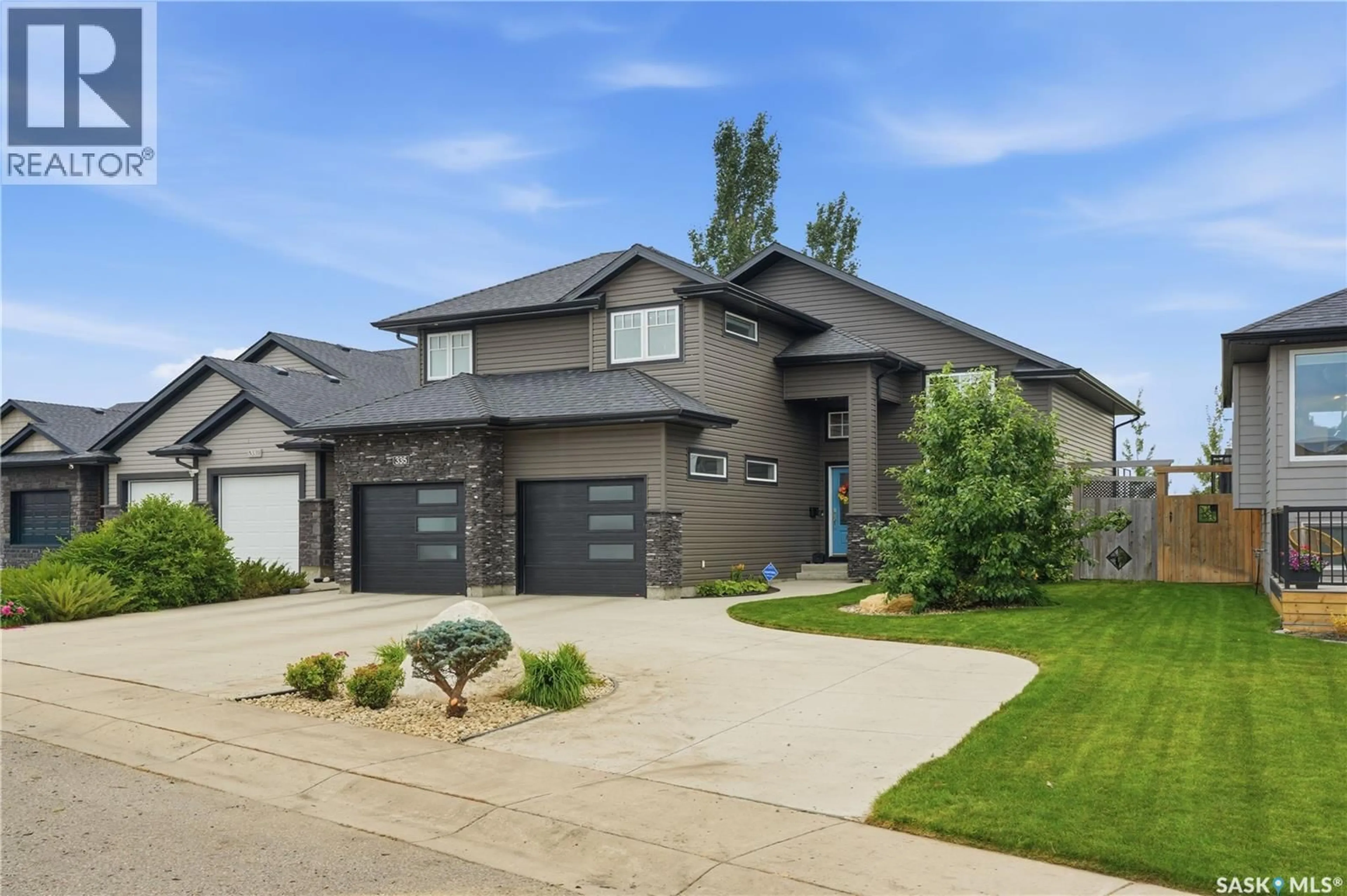 Home with brick exterior material, street for 335 DAWSON CRESCENT, Saskatoon Saskatchewan S7R0K1