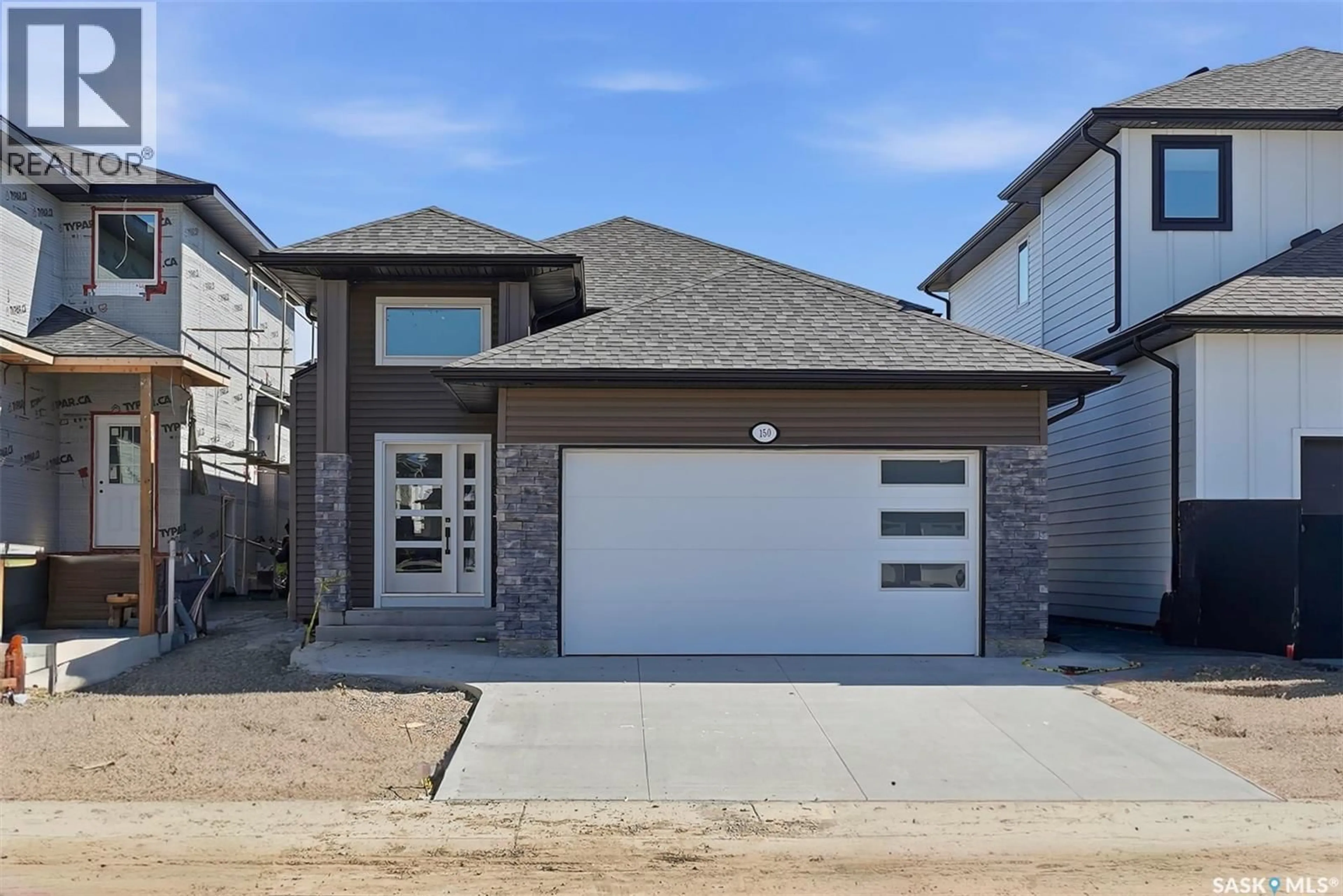 Home with brick exterior material, street for 150 SHARMA LANE, Saskatoon Saskatchewan S7W1J1