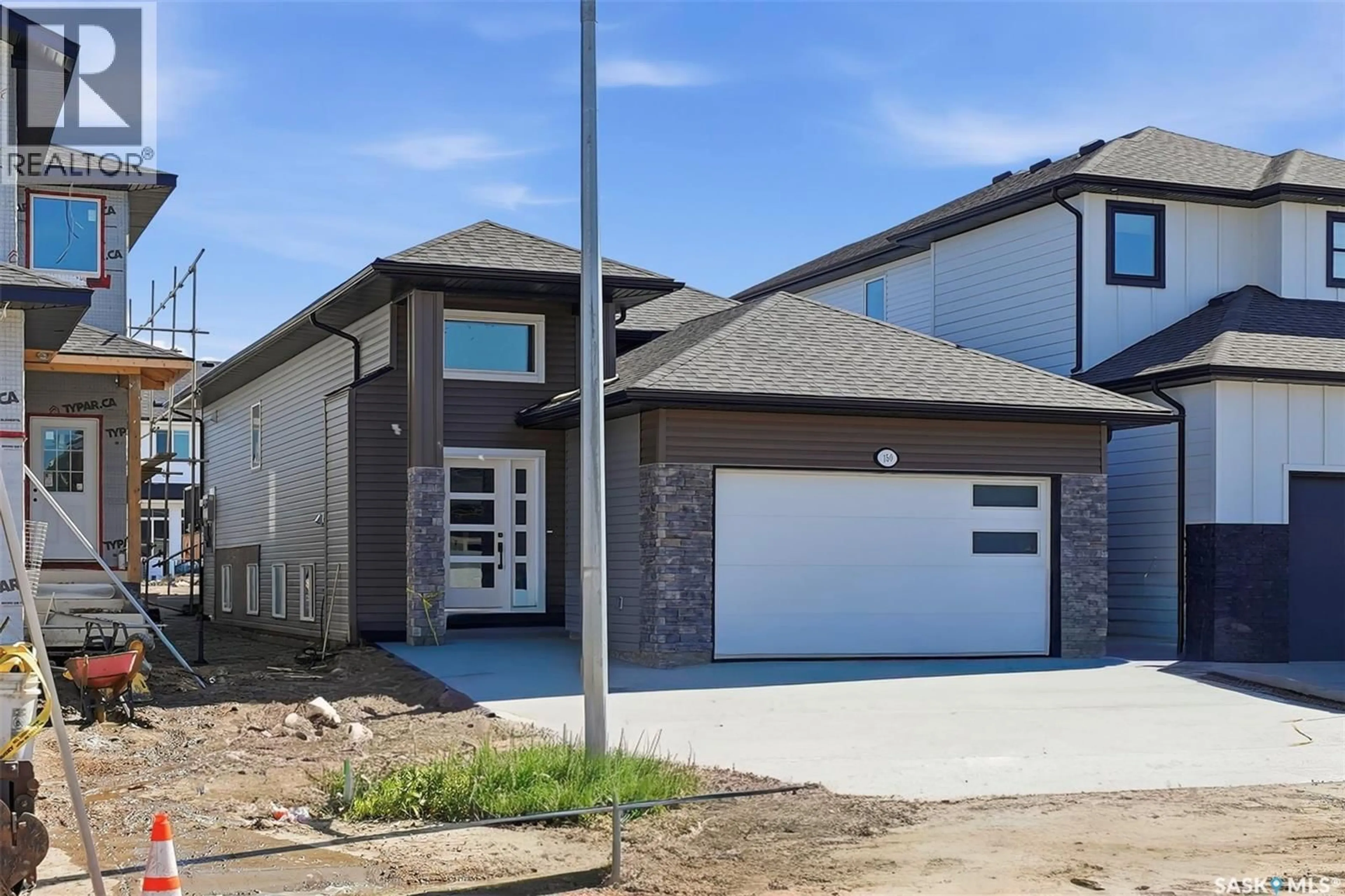 Home with brick exterior material, street for 150 SHARMA LANE, Saskatoon Saskatchewan S7W1J1