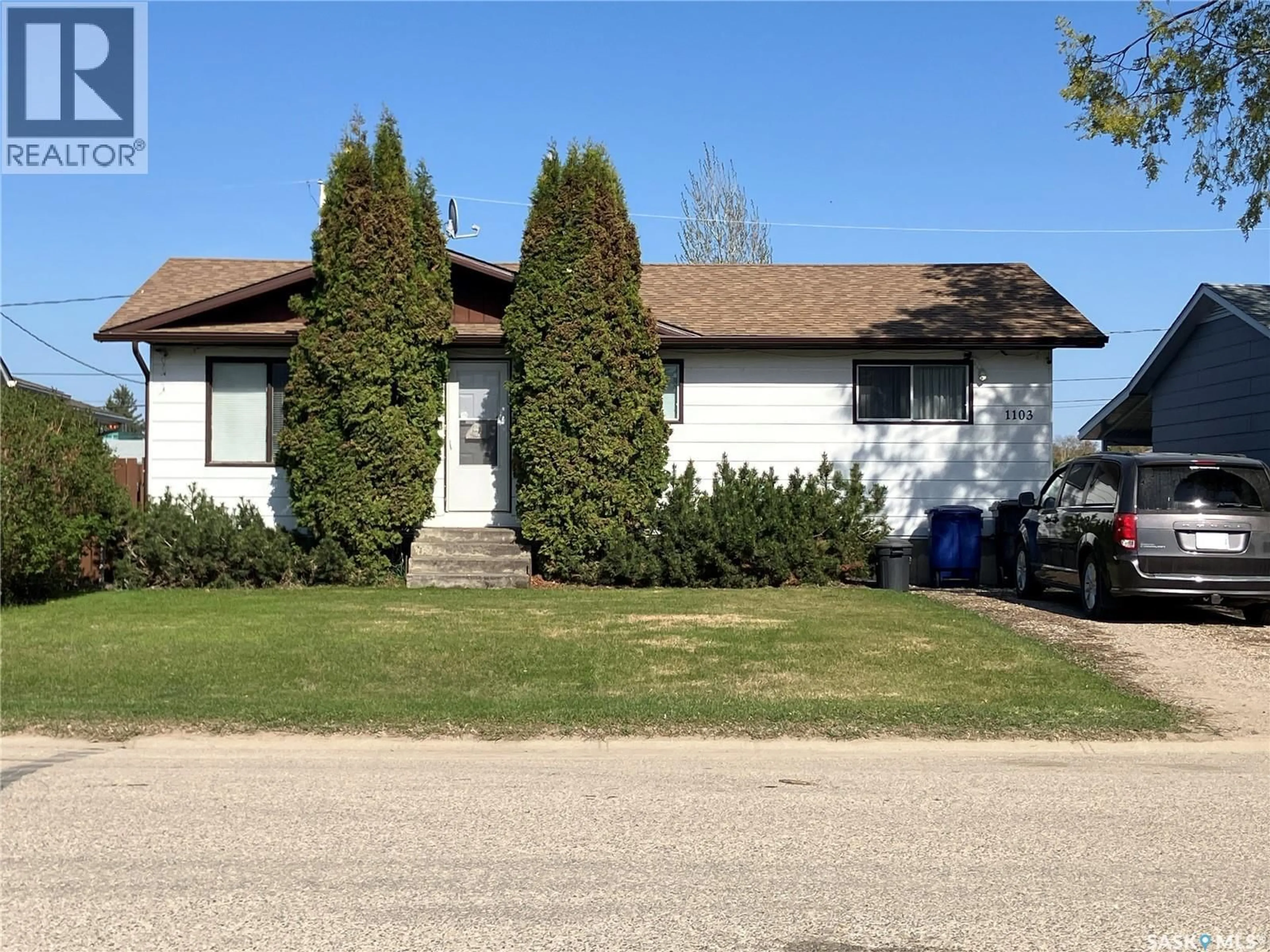 Home with vinyl exterior material, street for 1103 3RD STREET, Nipawin Saskatchewan S0E1E0