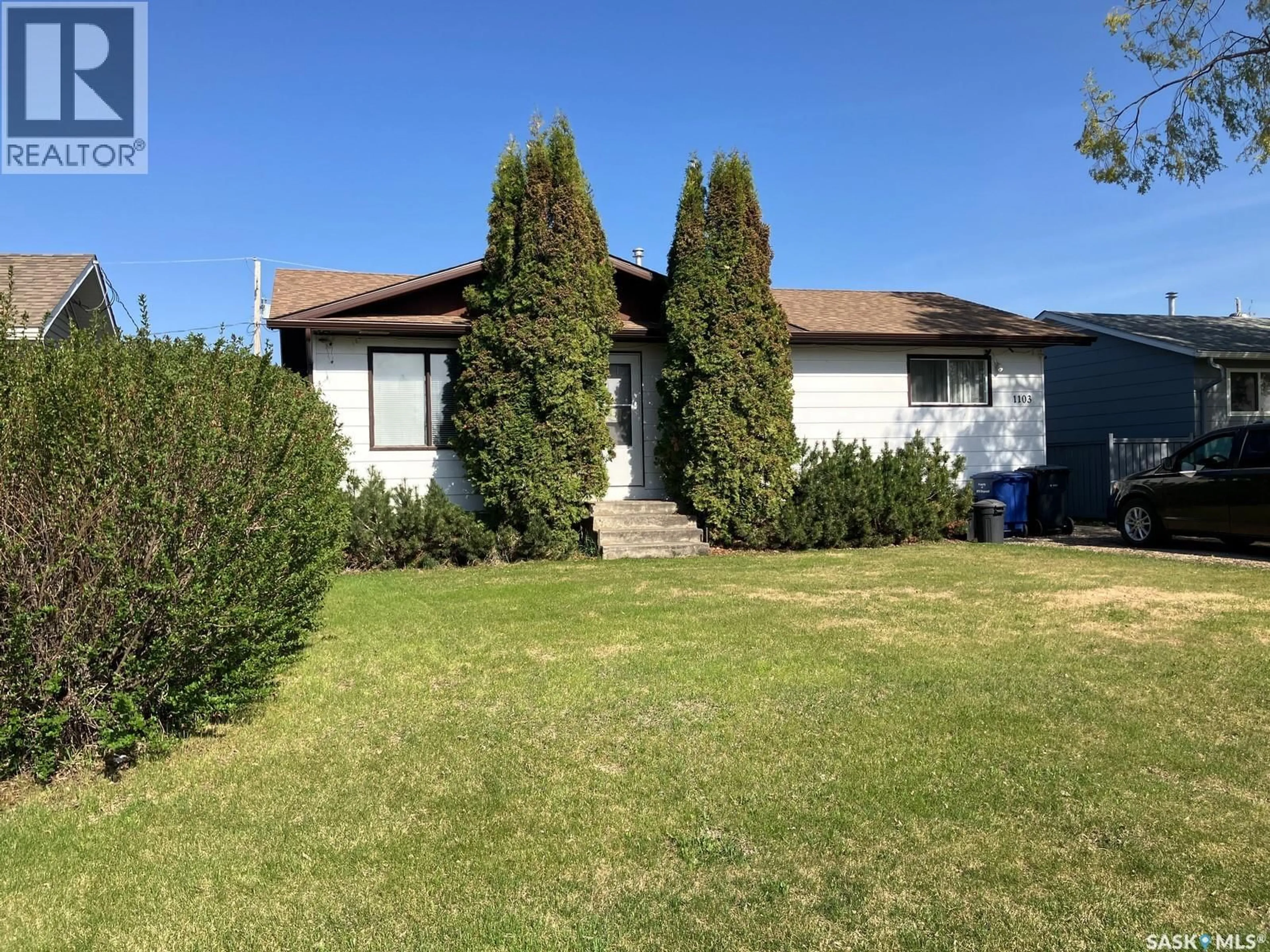 Home with vinyl exterior material, street for 1103 3RD STREET, Nipawin Saskatchewan S0E1E0