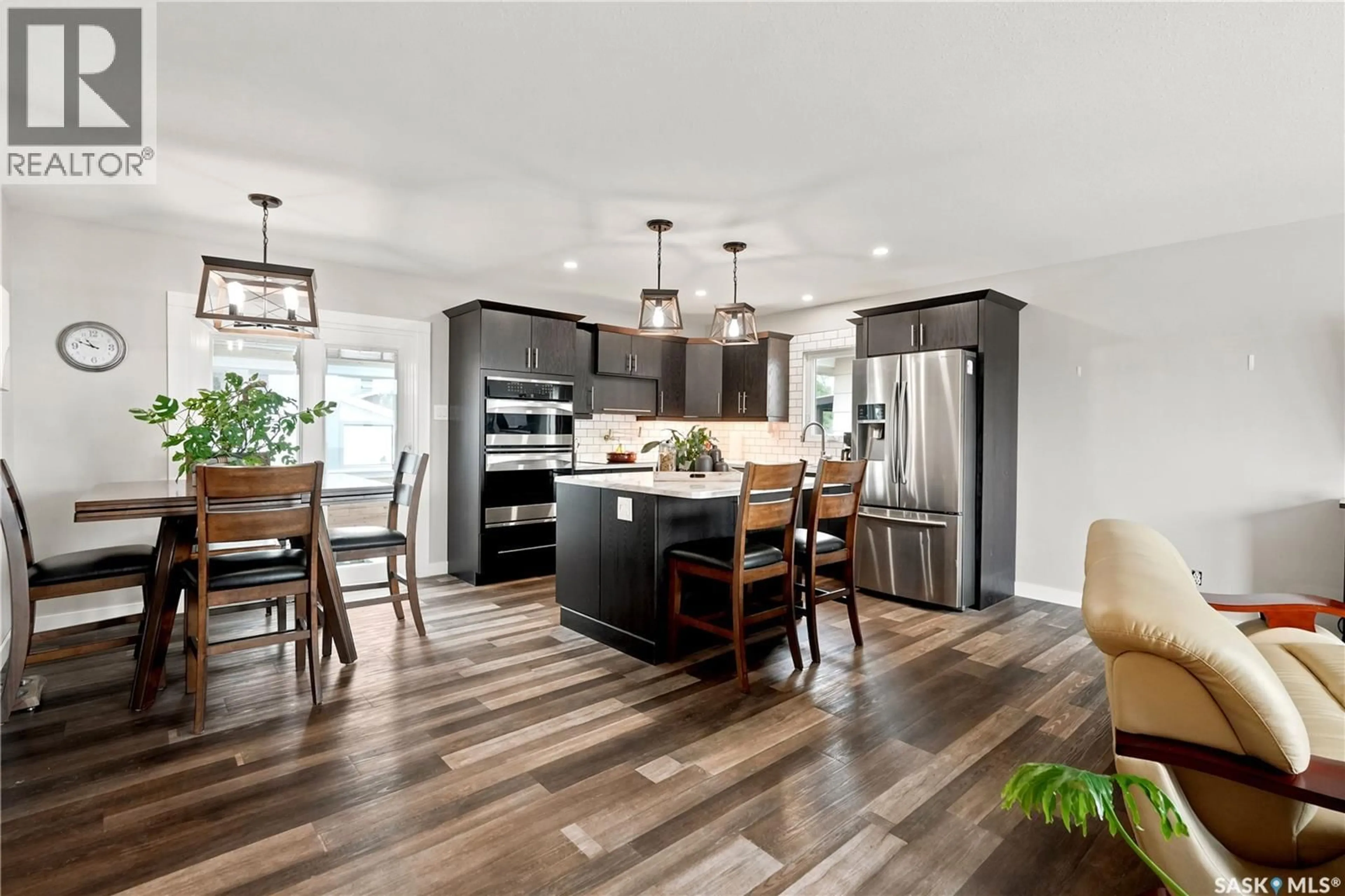 Open concept kitchen, wood/laminate floor for 1645 SMITH STREET, Moose Jaw Saskatchewan S6K1A7