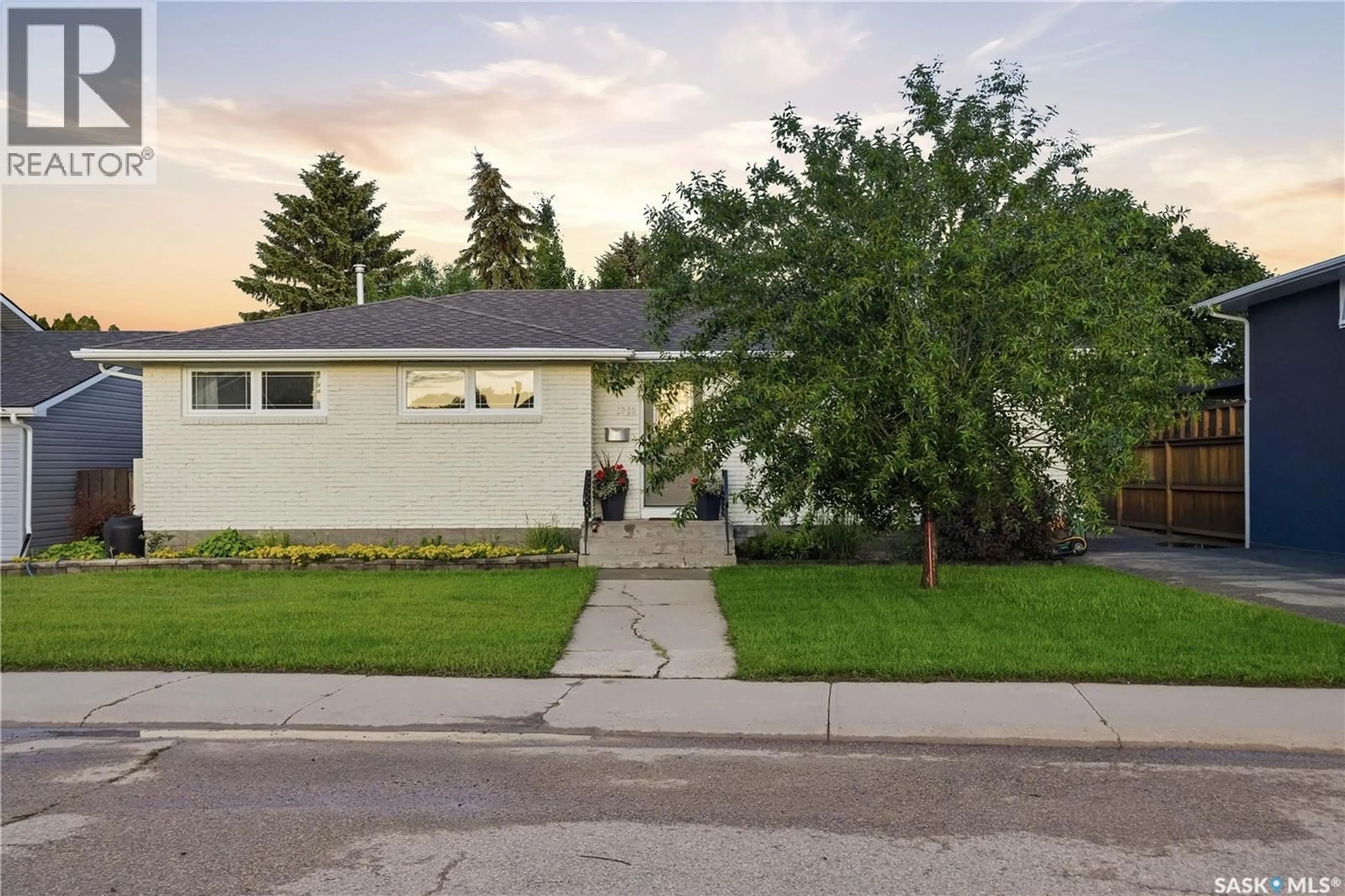Home with vinyl exterior material, street for 1313 PRINCE CRESCENT, Moose Jaw Saskatchewan S6H6E6
