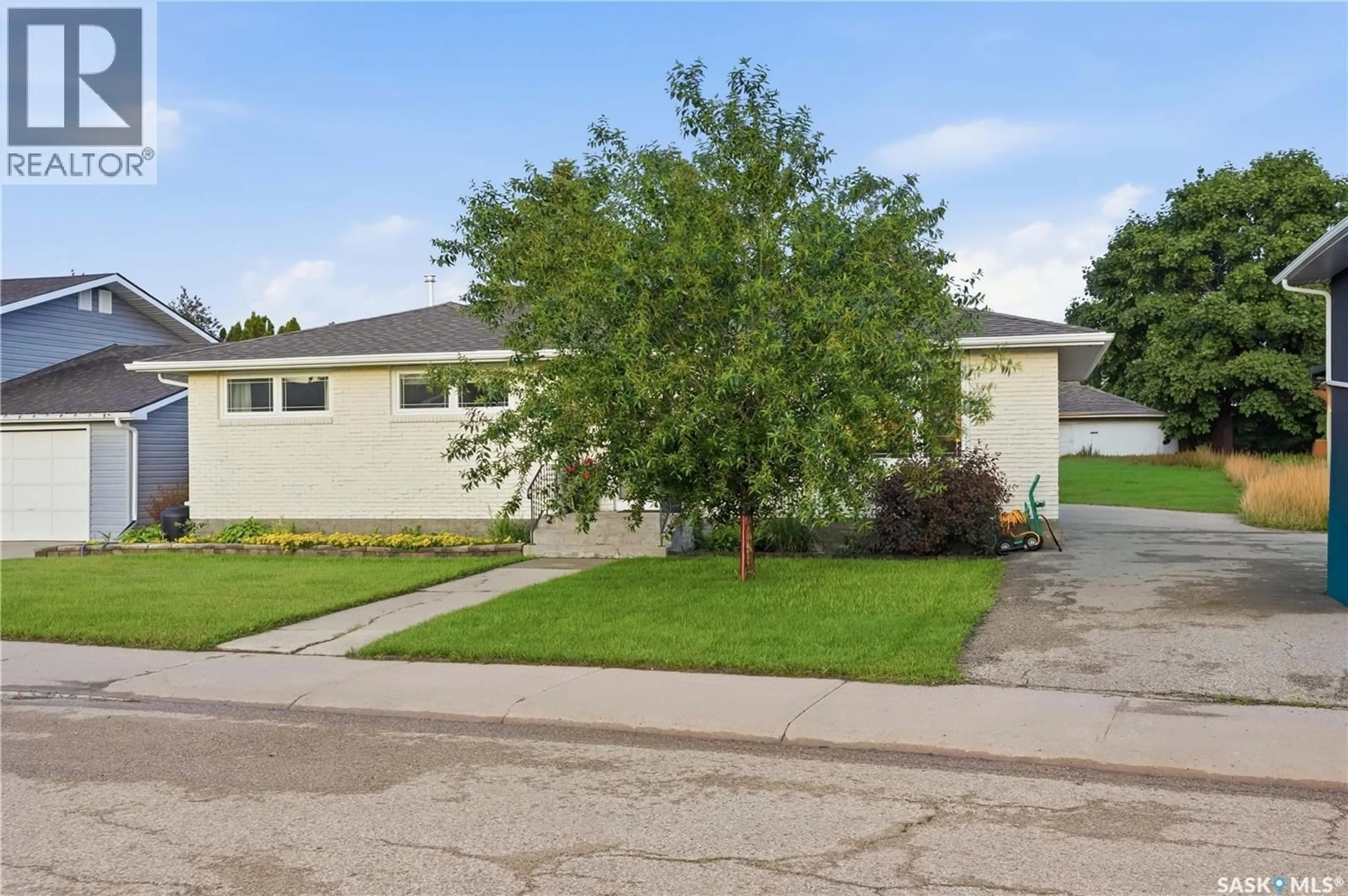 Home with vinyl exterior material, street for 1313 PRINCE CRESCENT, Moose Jaw Saskatchewan S6H6E6