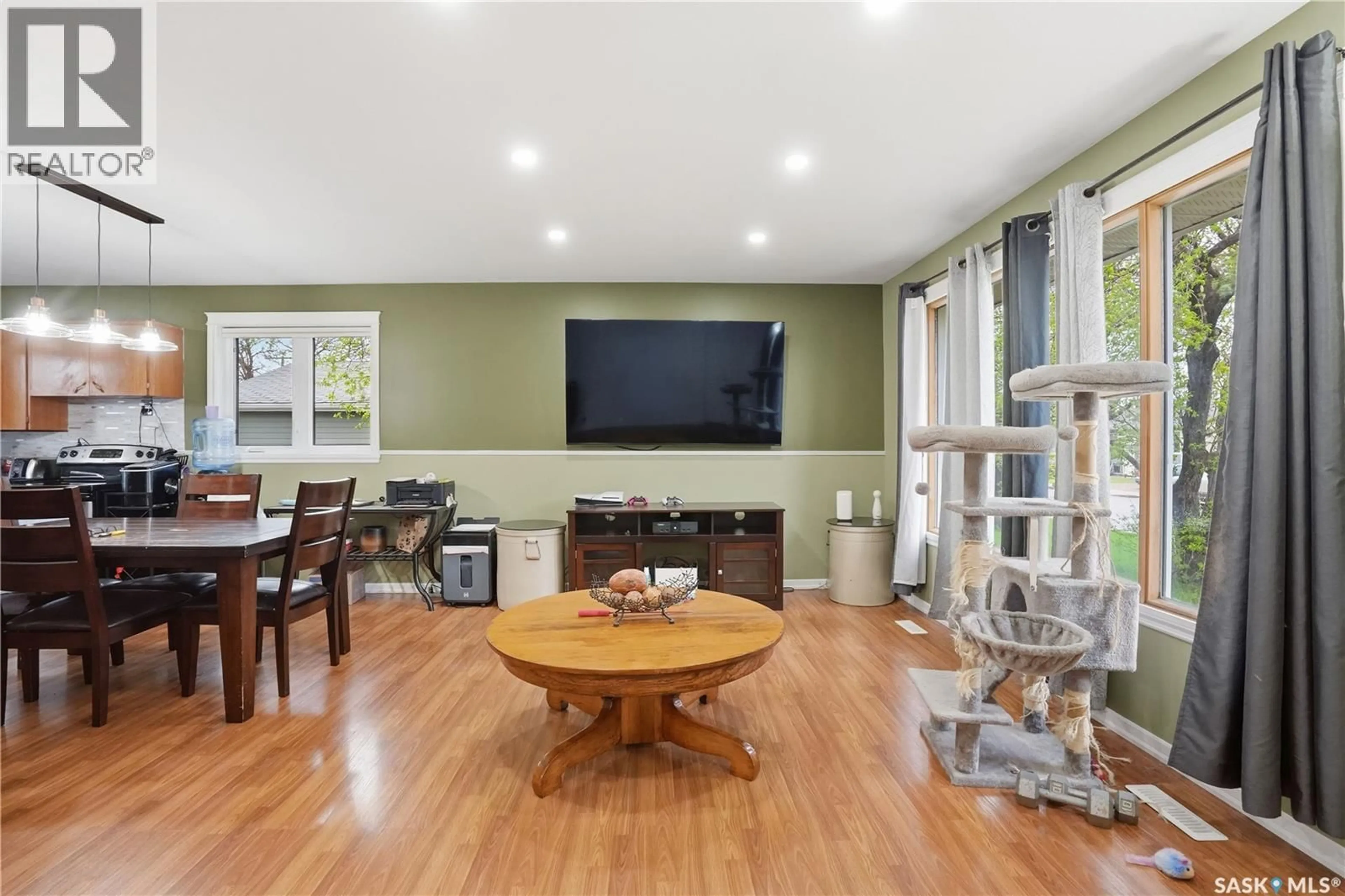 Living room with furniture, wood/laminate floor for 1007 WARNER STREET, Moose Jaw Saskatchewan S6H5S6