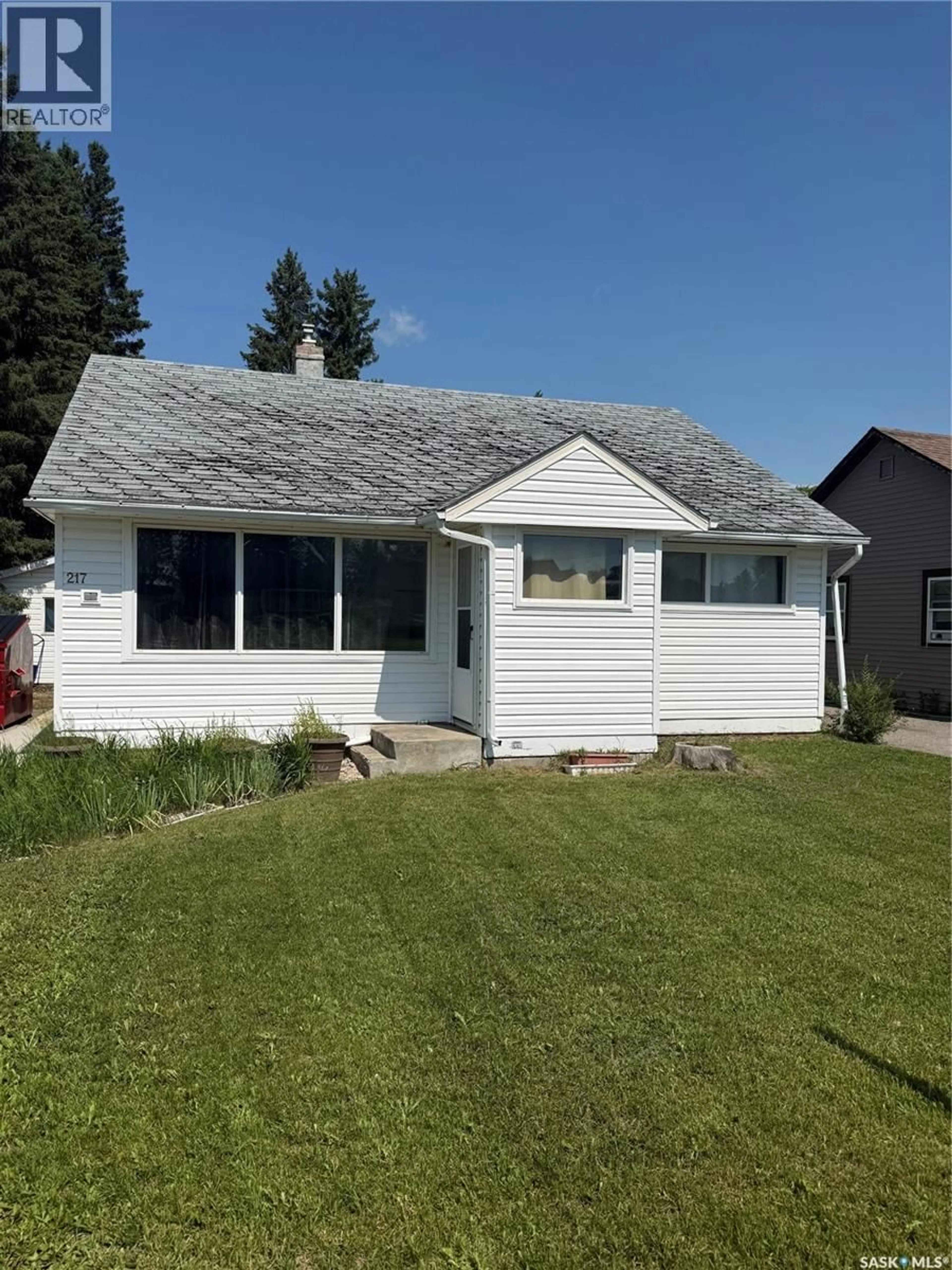 Home with vinyl exterior material, street for E - 217 3A STREET, Nipawin Saskatchewan S0E1E0