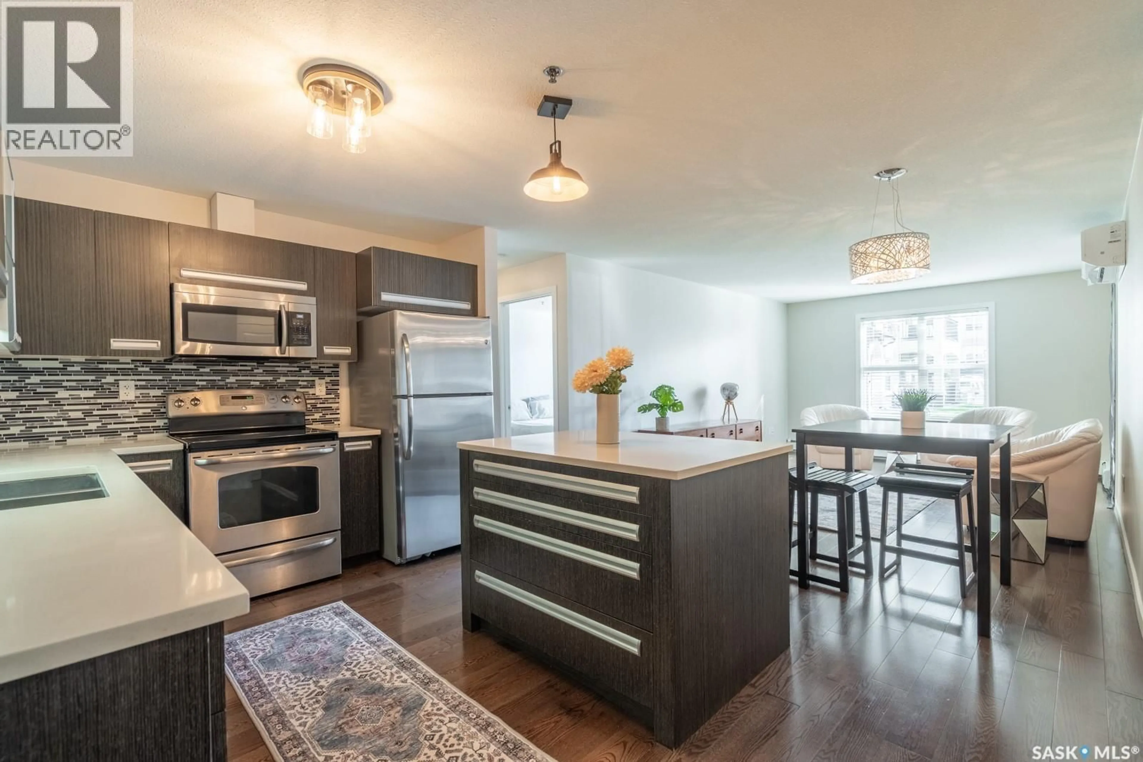 Open concept kitchen, wood/laminate floor for 1510 - 116 NEVILLE DRIVE, Regina Saskatchewan S4Z0A3