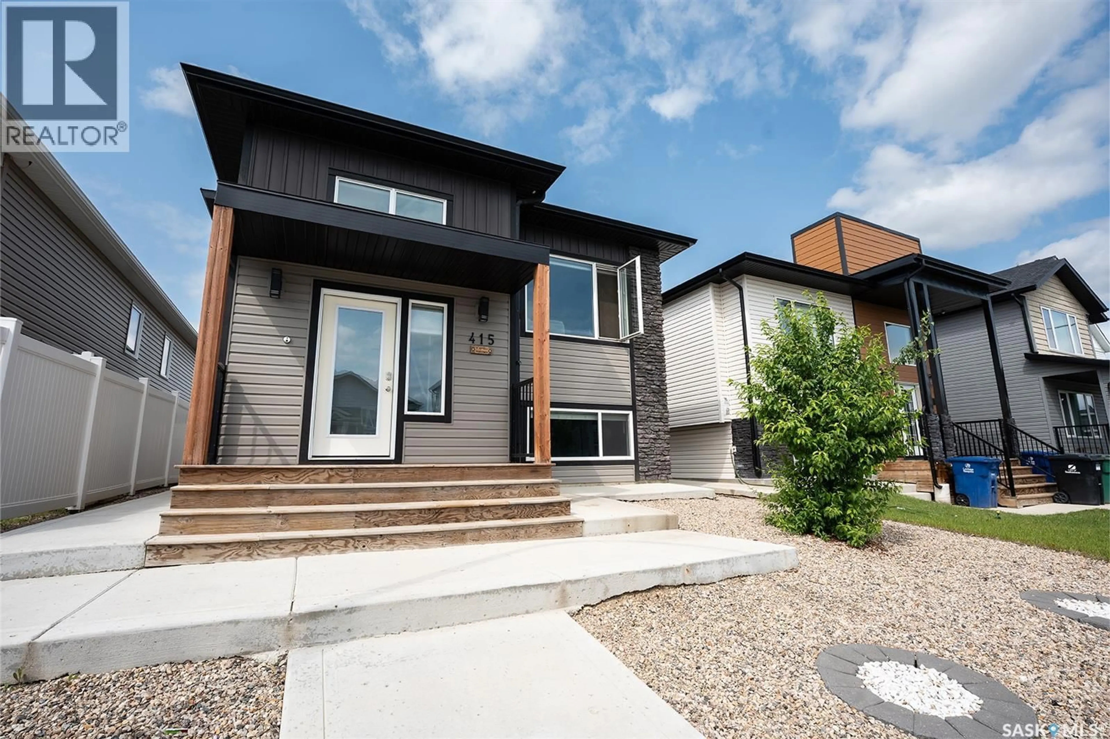 Home with brick exterior material, street for 415 MCARTHUR CRESCENT, Saskatoon Saskatchewan S7L6Y3