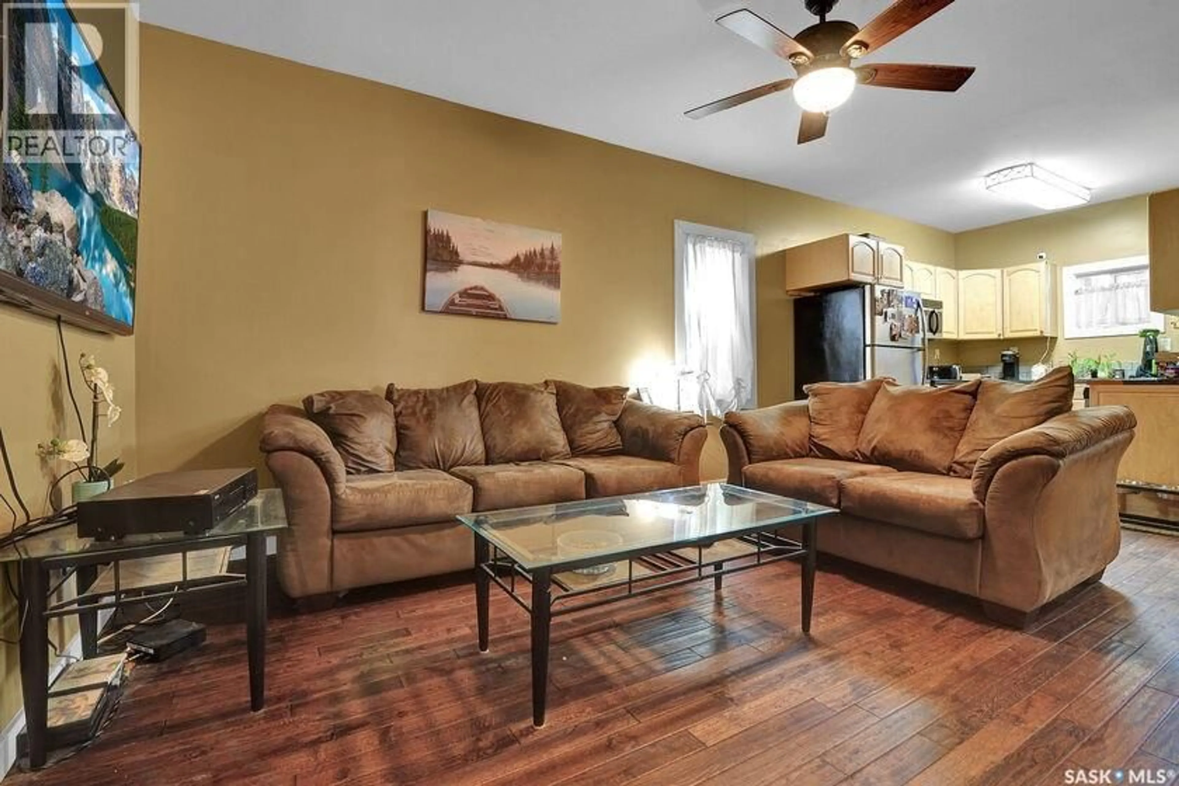 Living room with furniture, wood/laminate floor for 2258 OSLER STREET, Regina Saskatchewan S4P1W8