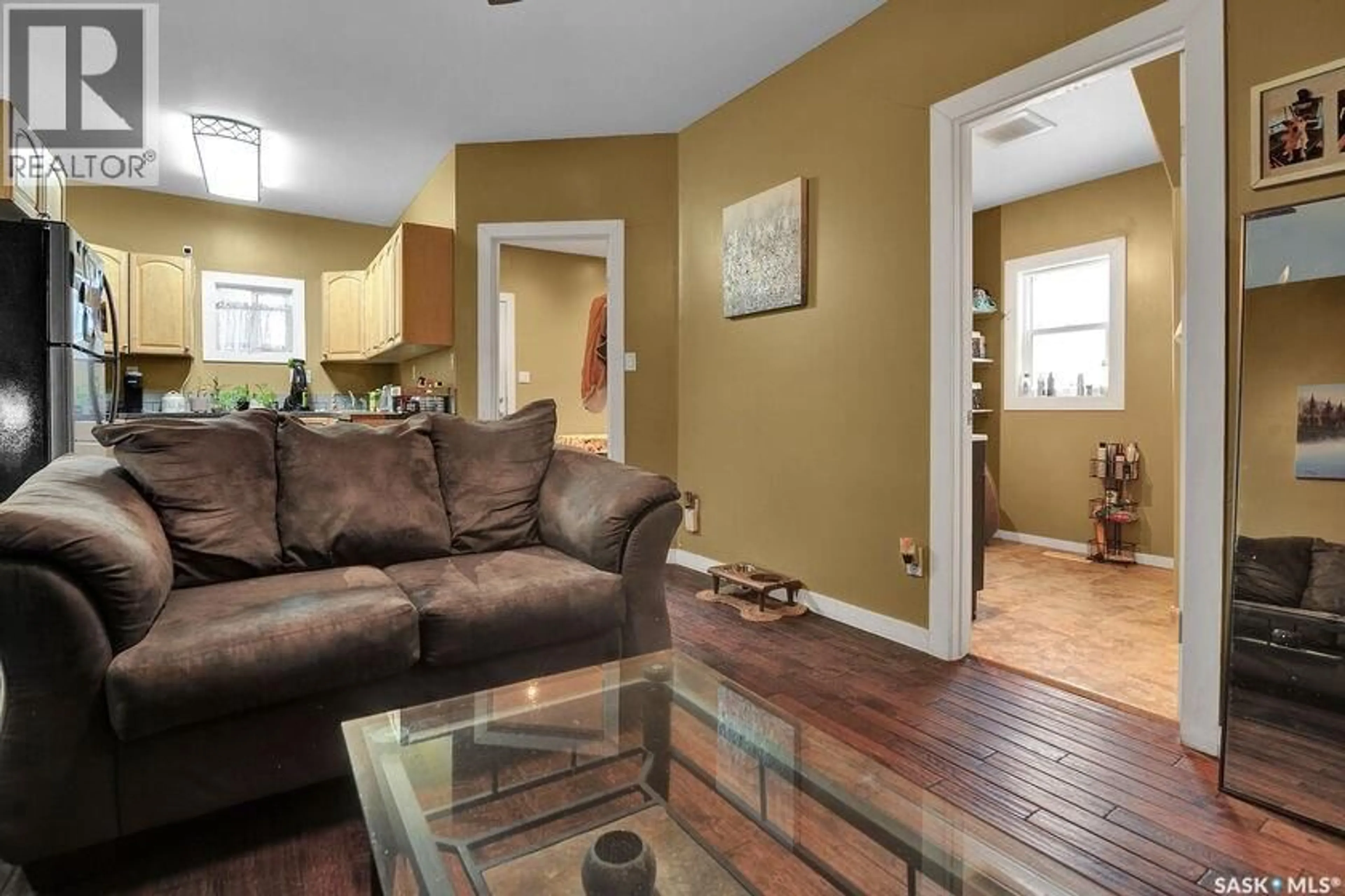 Living room with furniture, wood/laminate floor for 2258 OSLER STREET, Regina Saskatchewan S4P1W8