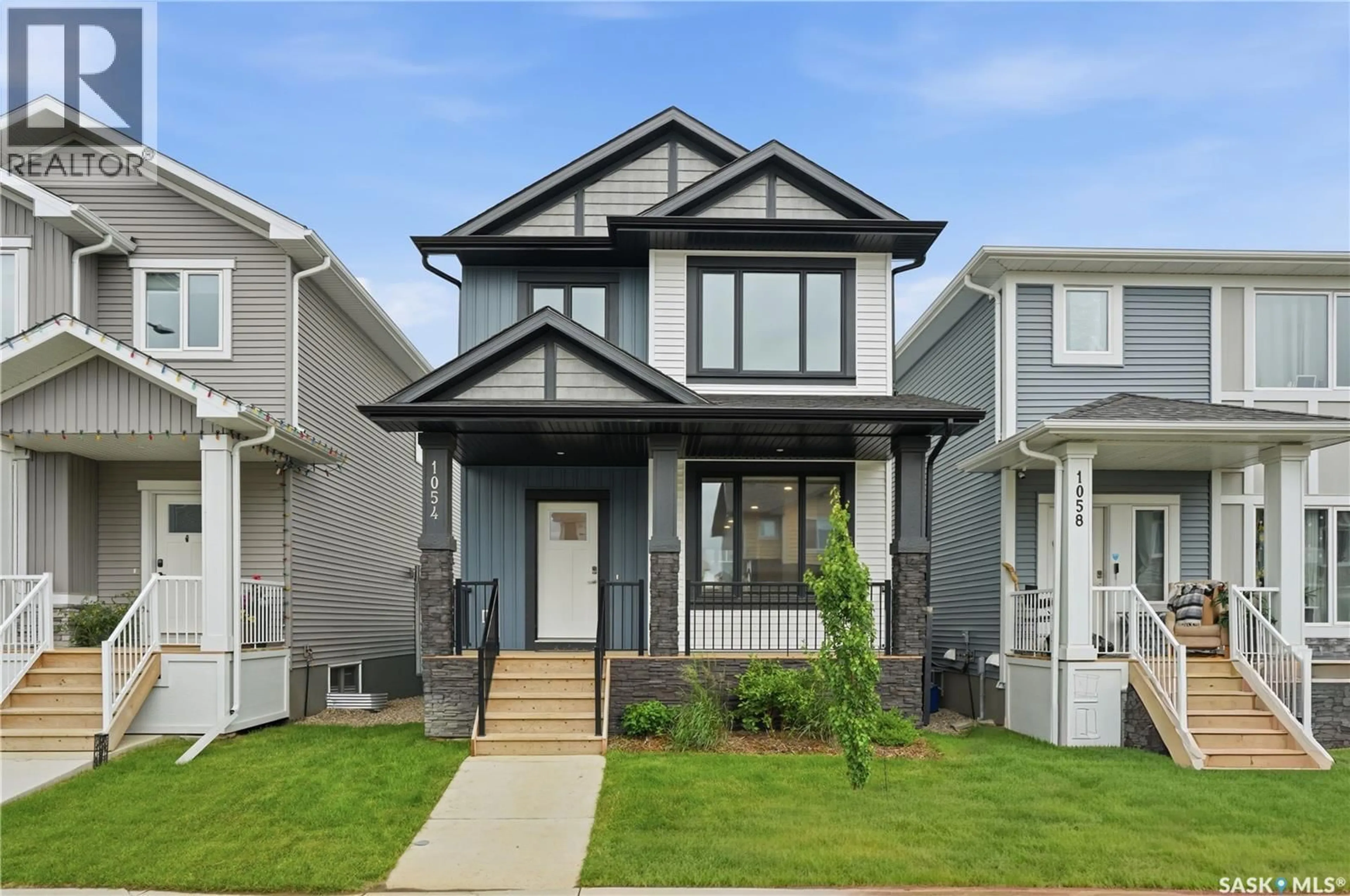 Home with vinyl exterior material, street for 1054 BRIGHTON GATE, Saskatoon Saskatchewan S7V1S6