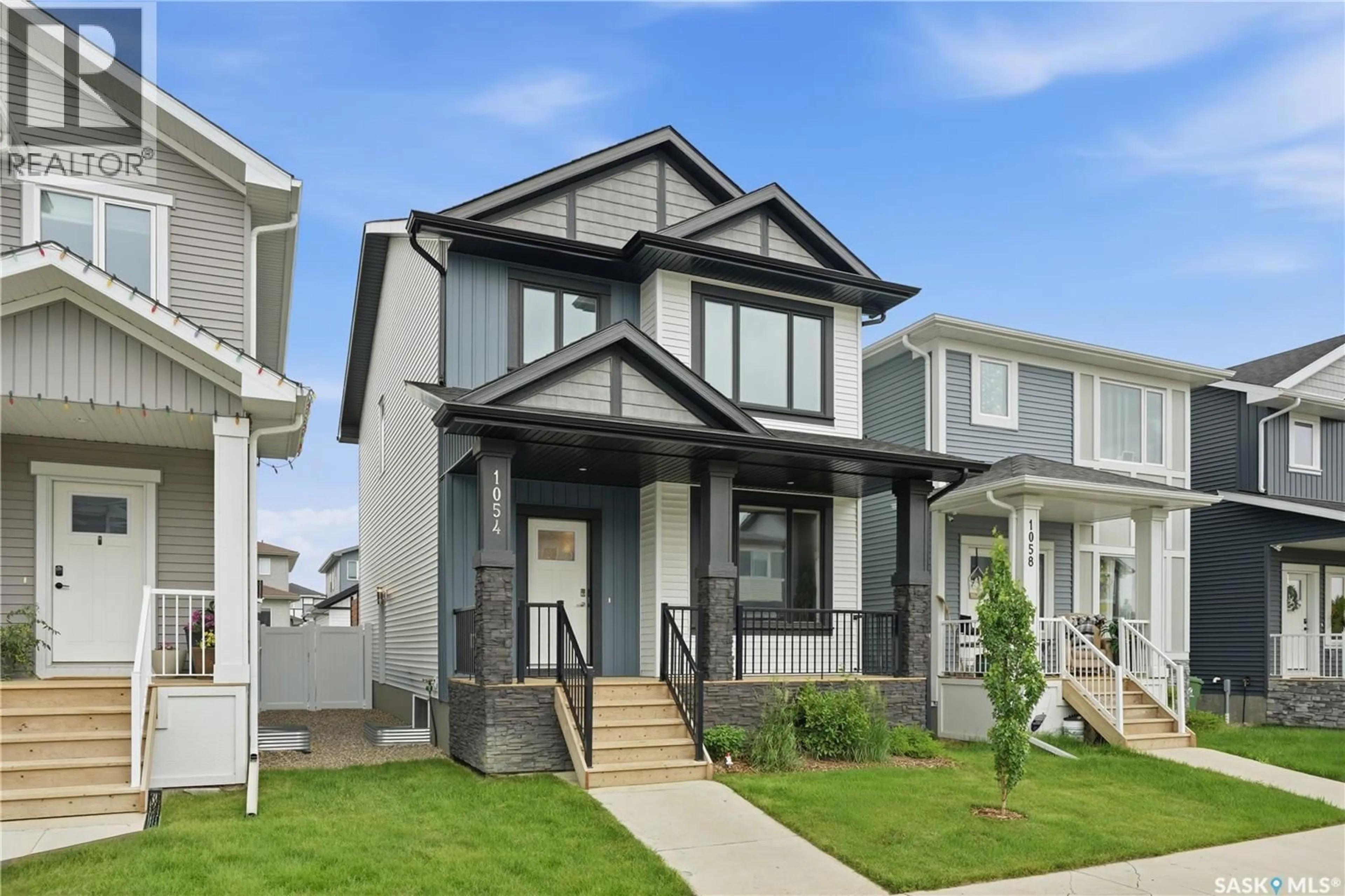 Home with vinyl exterior material, street for 1054 BRIGHTON GATE, Saskatoon Saskatchewan S7V1S6