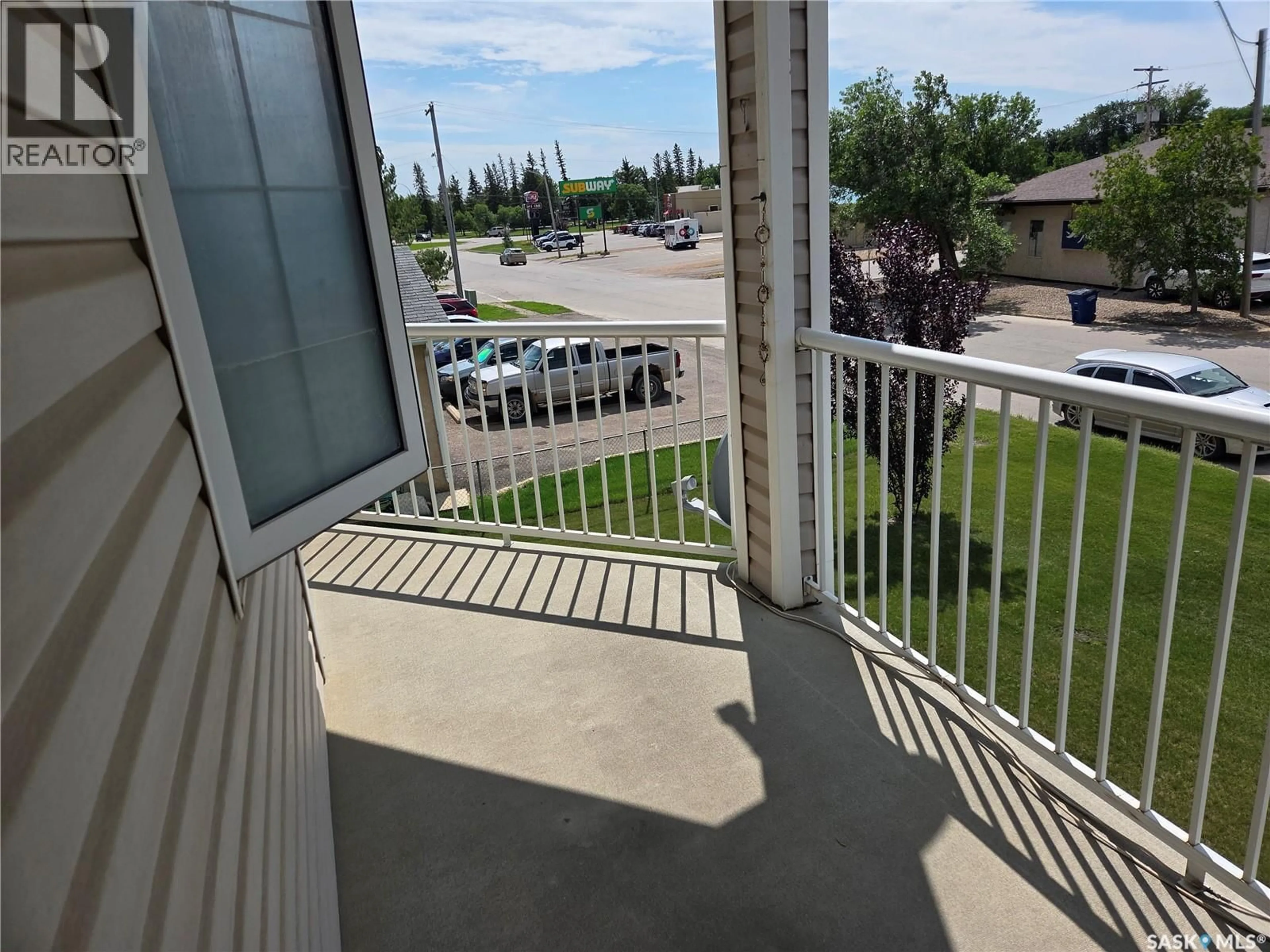 Balcony in the apartment, city buildings view from balcony for 201 806 100A STREET, Tisdale Saskatchewan S0E1T0