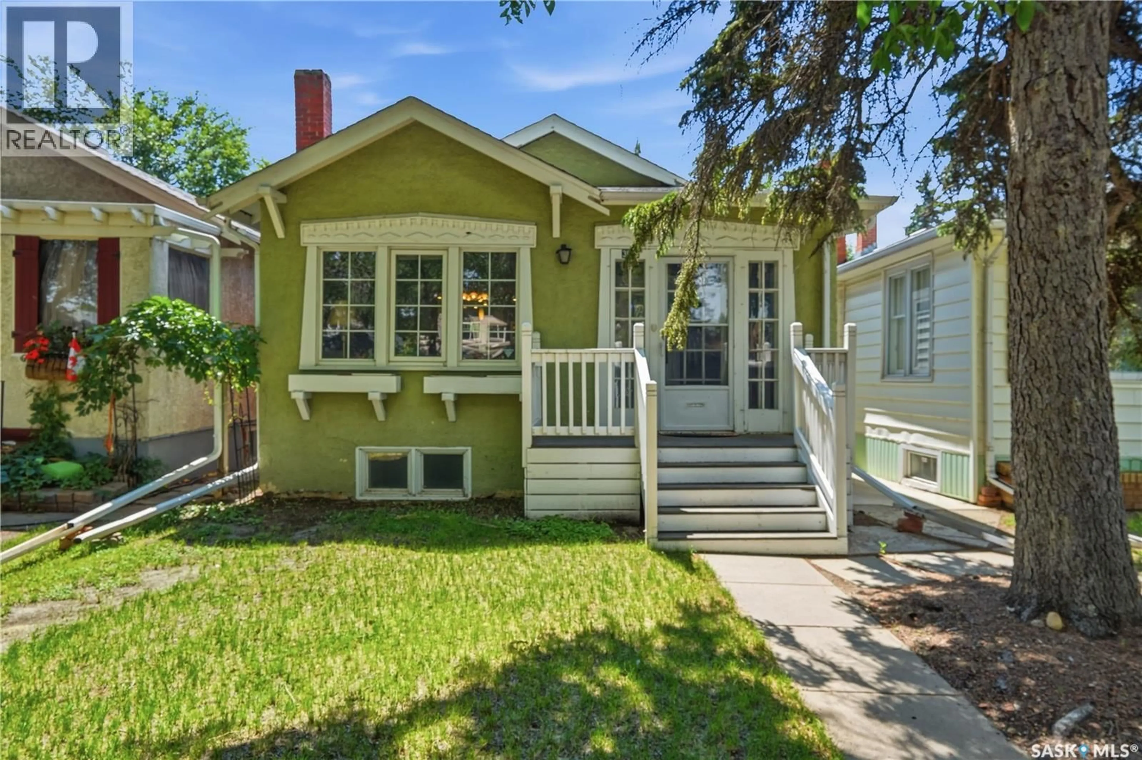 Home with vinyl exterior material, street for 3625 VICTORIA AVENUE, Regina Saskatchewan S4T1M4