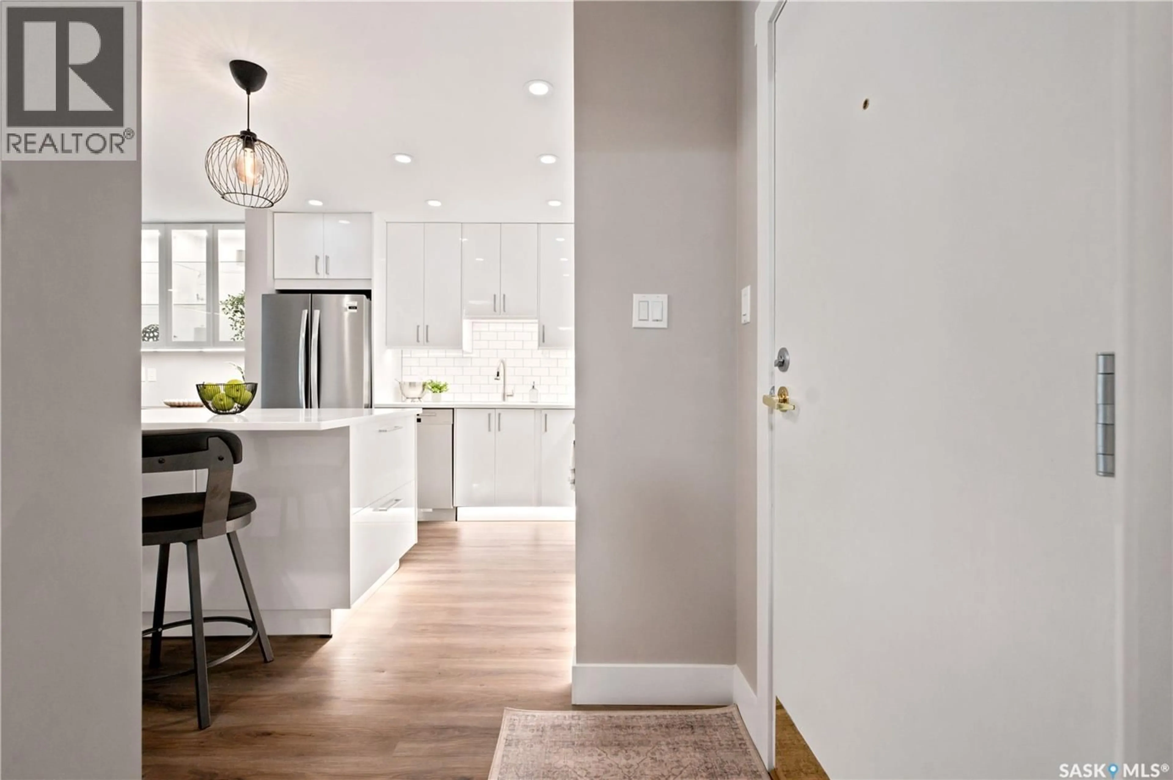 Open concept kitchen, wood/laminate floor for 105 - 410 MAIN STREET, Saskatoon Saskatchewan S7N0B8