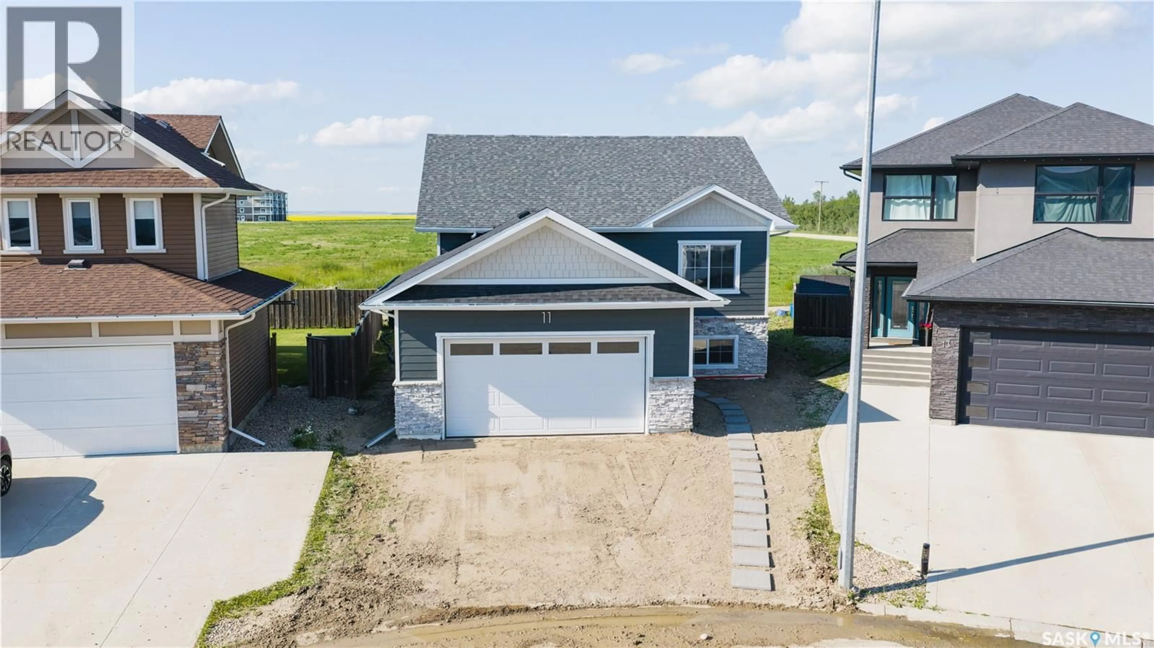 A pic from outside/outdoor area/front of a property/back of a property/a pic from drone, street for 11 ASPEN PLACE, Humboldt Saskatchewan S0K2A0