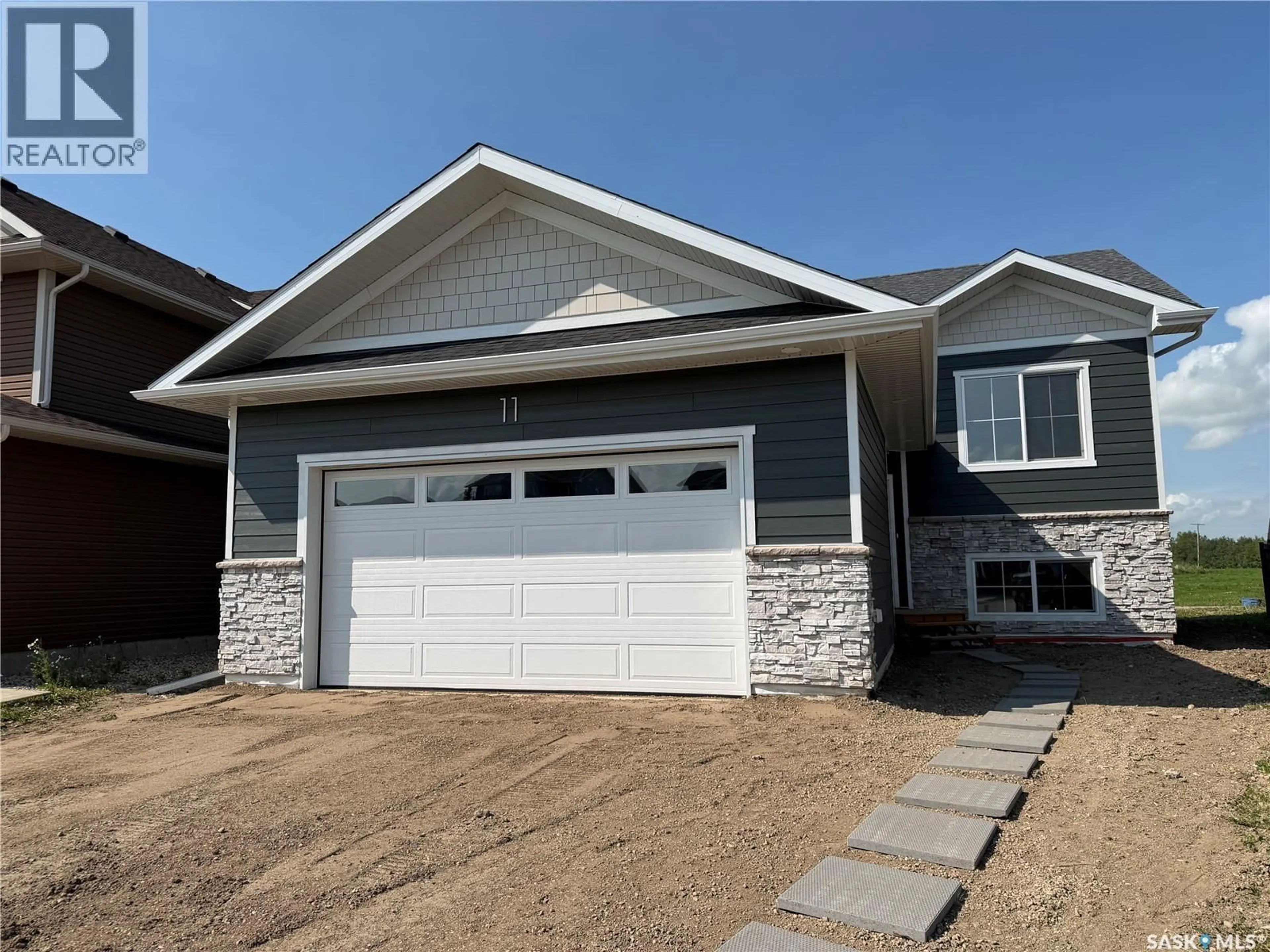 Home with vinyl exterior material, street for 11 ASPEN PLACE, Humboldt Saskatchewan S0K2A0