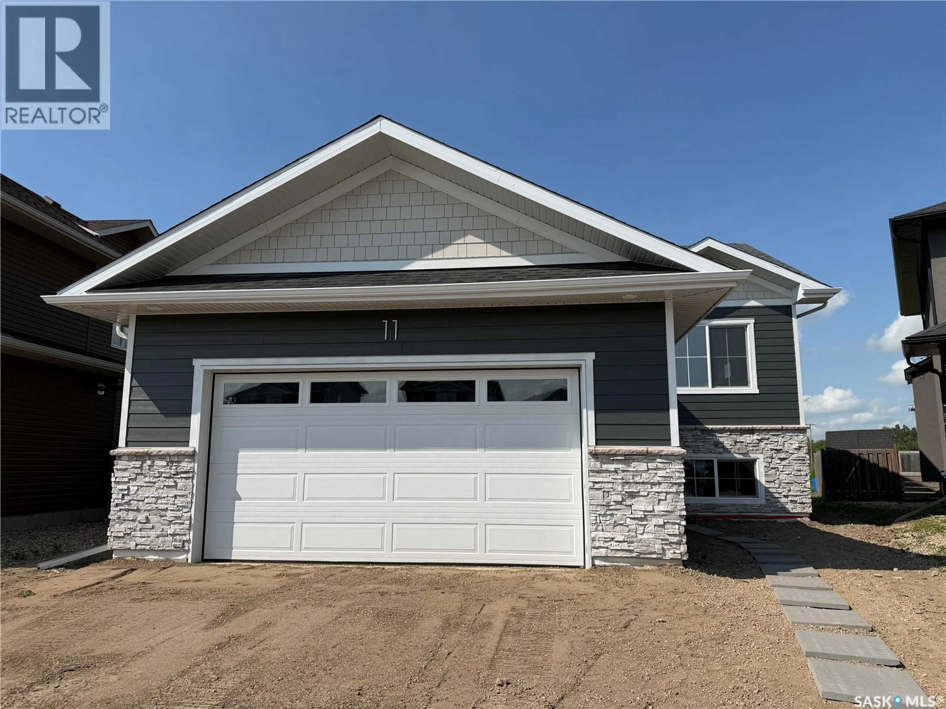 Home with vinyl exterior material, street for 11 ASPEN PLACE, Humboldt Saskatchewan S0K2A0