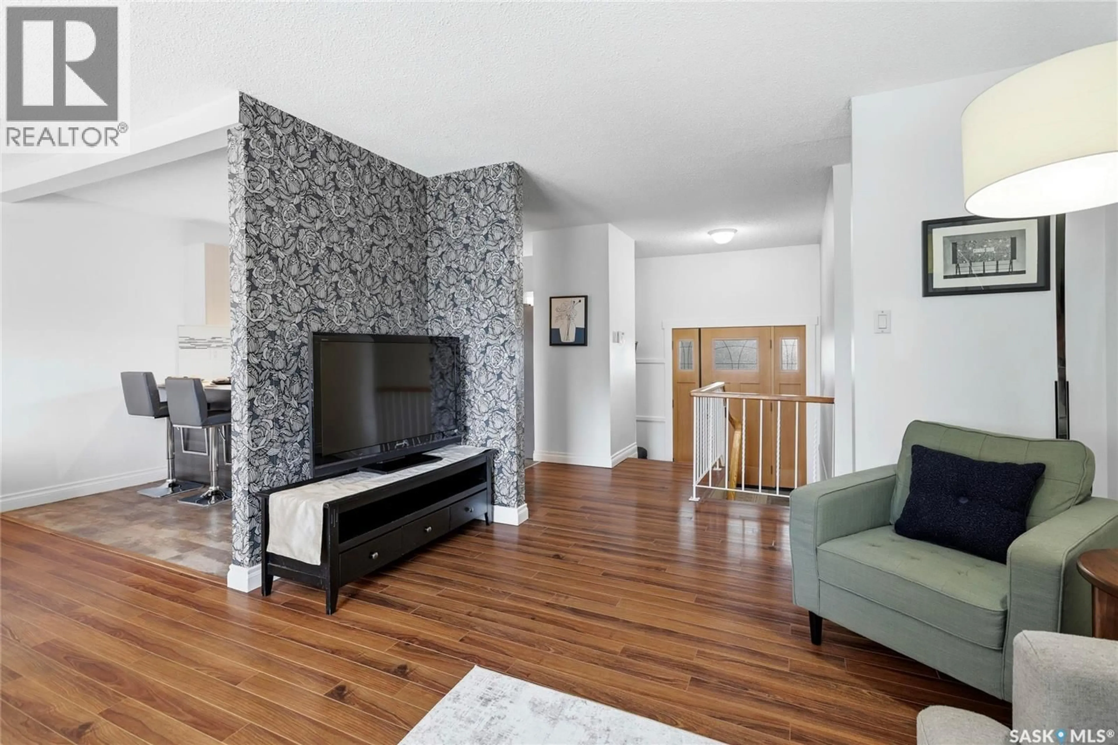 Living room with furniture, wood/laminate floor for 80 CAMERON CRESCENT, Regina Saskatchewan S4S2X2