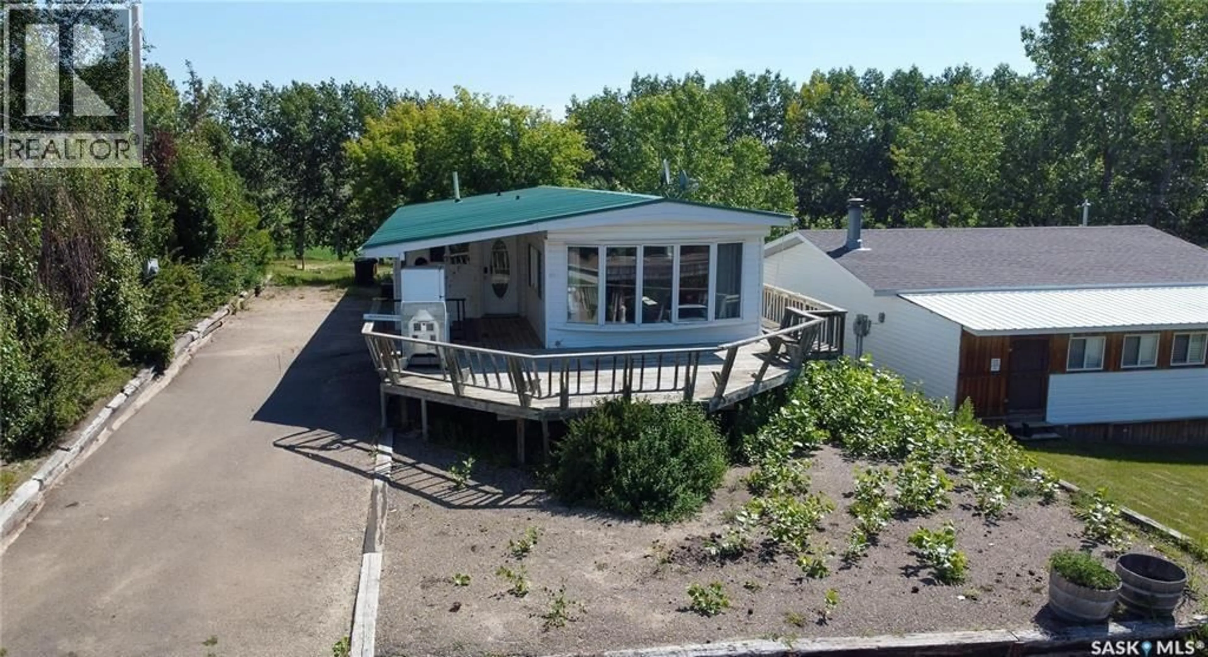 A pic from outside/outdoor area/front of a property/back of a property/a pic from drone, water/lake/river/ocean view for 12 HIGHLAND AVENUE, Jackfish Lake Saskatchewan S0M1X0
