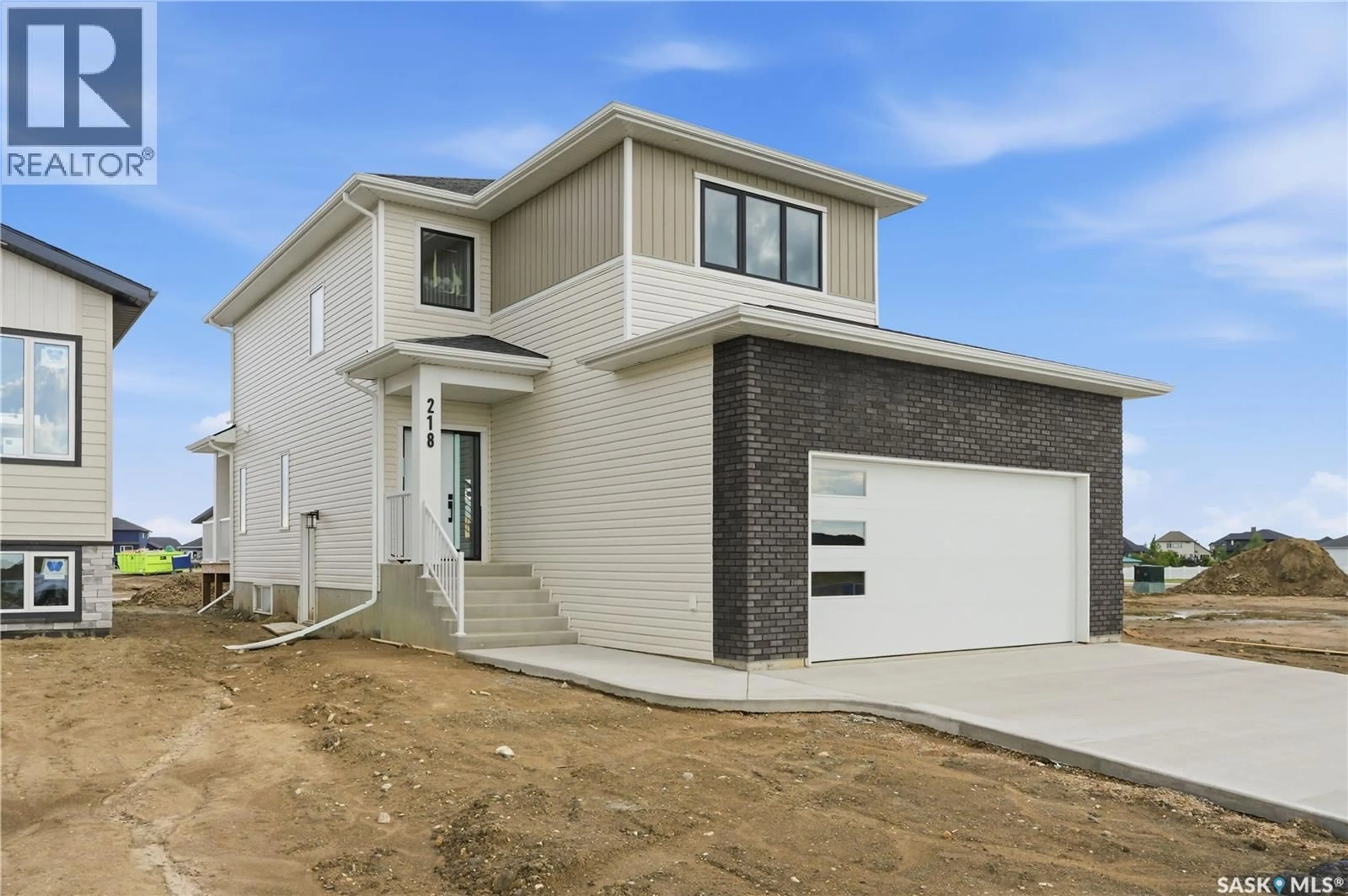 Home with brick exterior material, street for 218 VETERANS DRIVE, Warman Saskatchewan S0K0A1