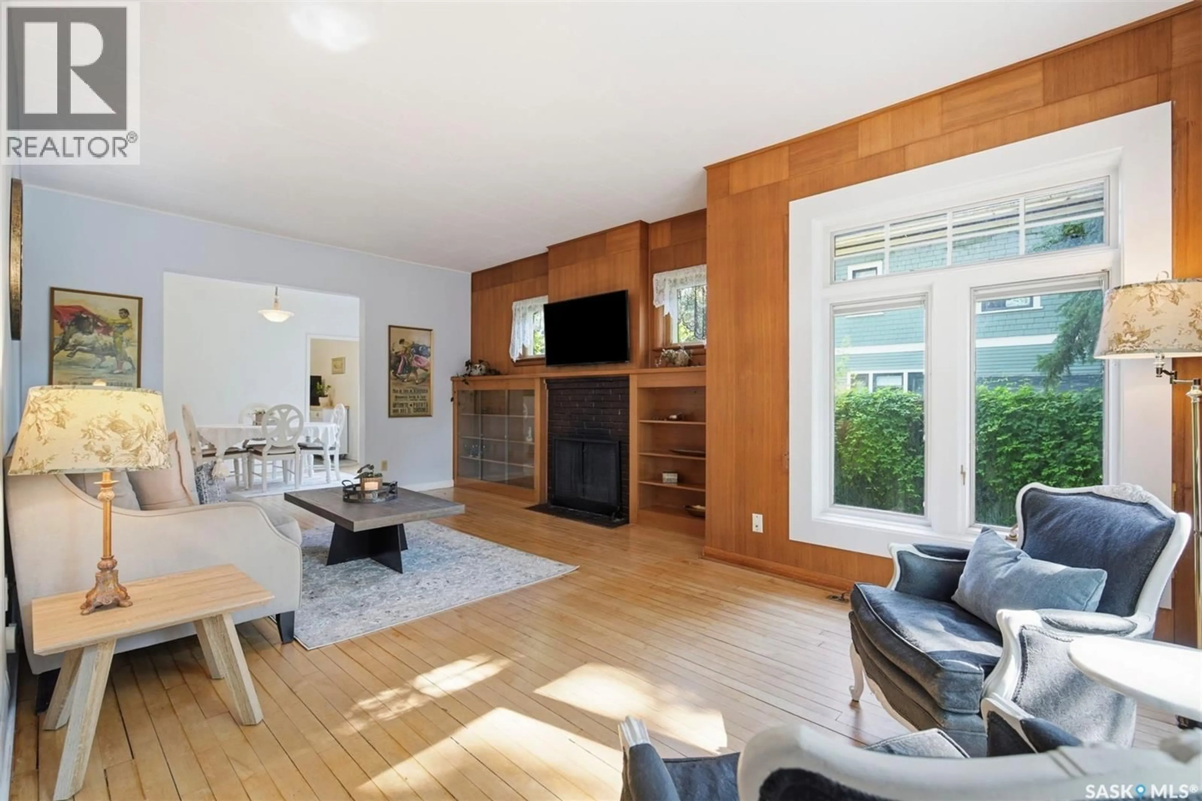 Living room with furniture, wood/laminate floor for 720 TEMPERANCE STREET, Saskatoon Saskatchewan S7N0M7
