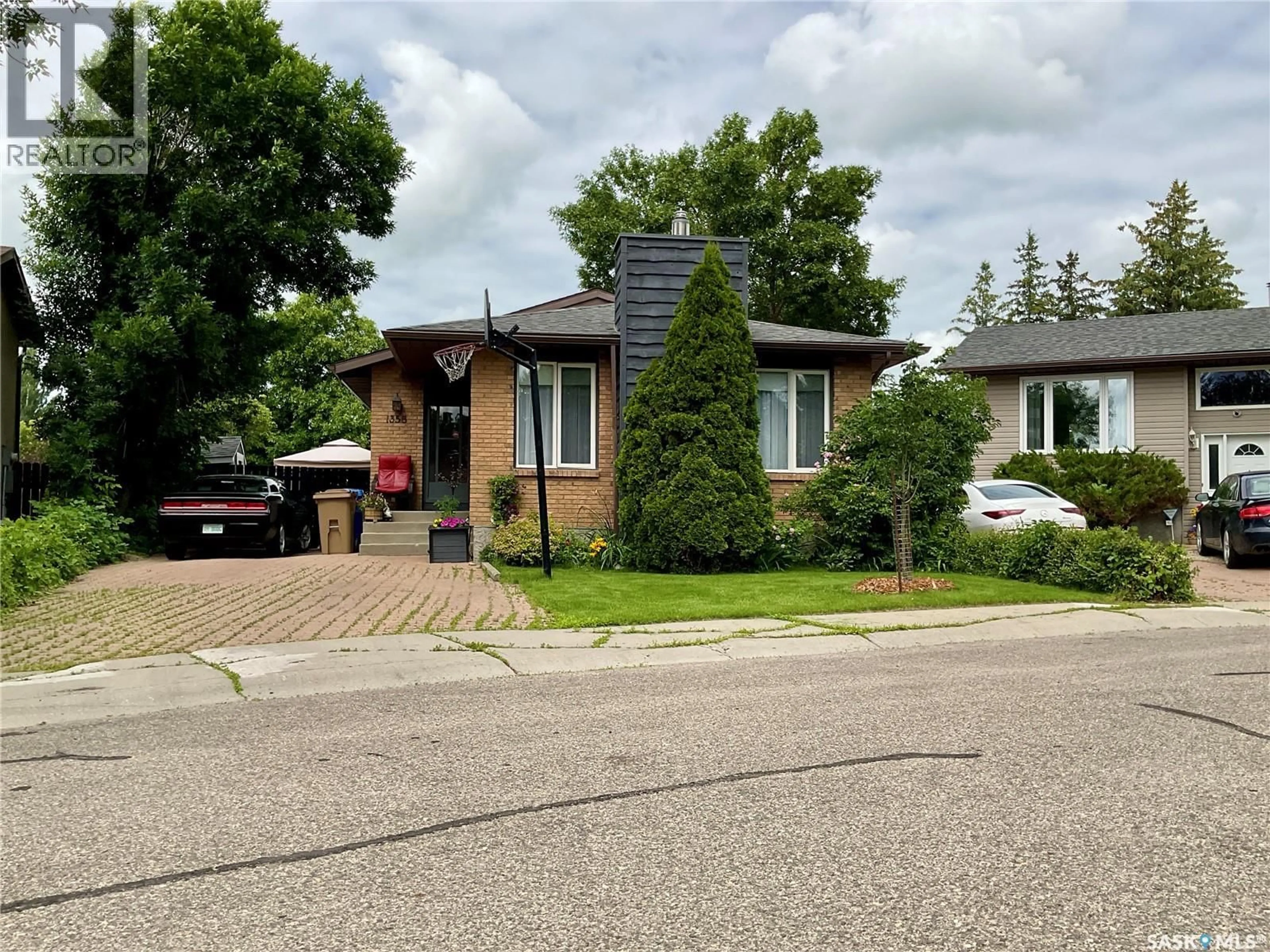 Home with brick exterior material, street for 1358 LAKEWOOD CRESCENT, Regina Saskatchewan S4X3H3
