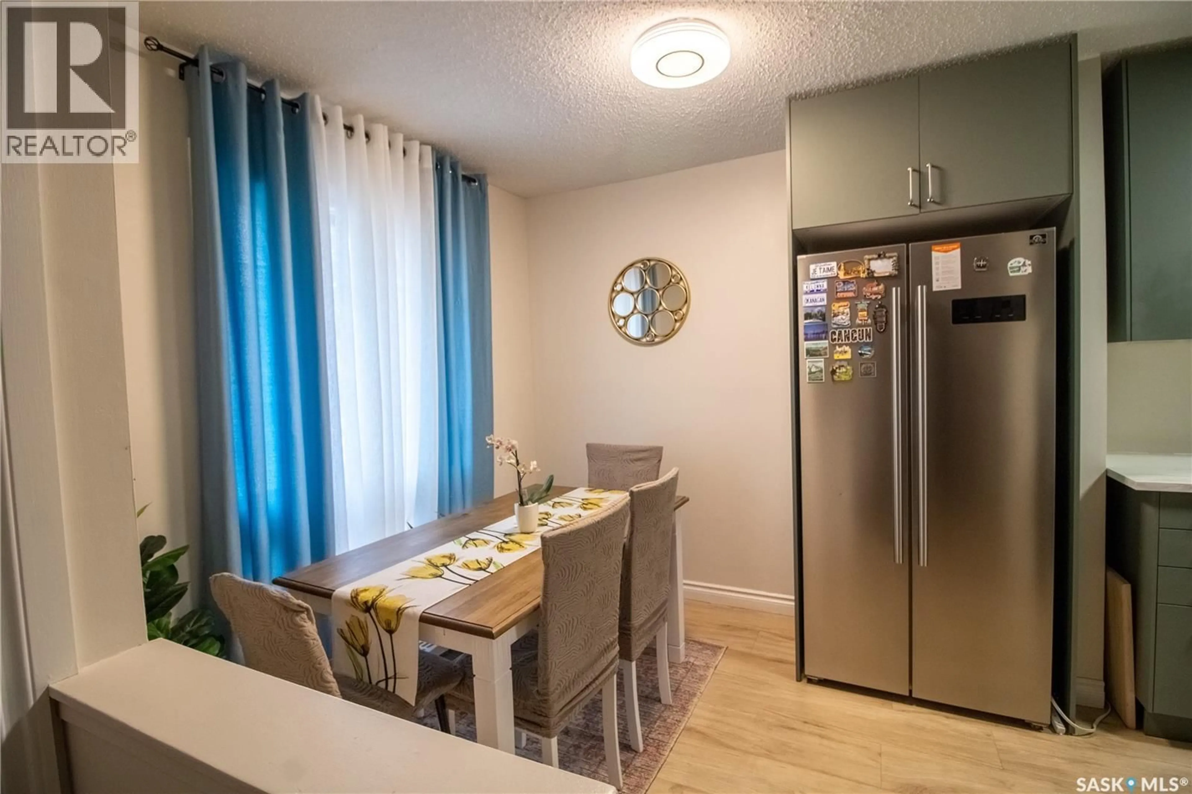 Dining room, wood/laminate floor for 1128 - 59 MCKERCHER DRIVE, Saskatoon Saskatchewan S7H4Y7