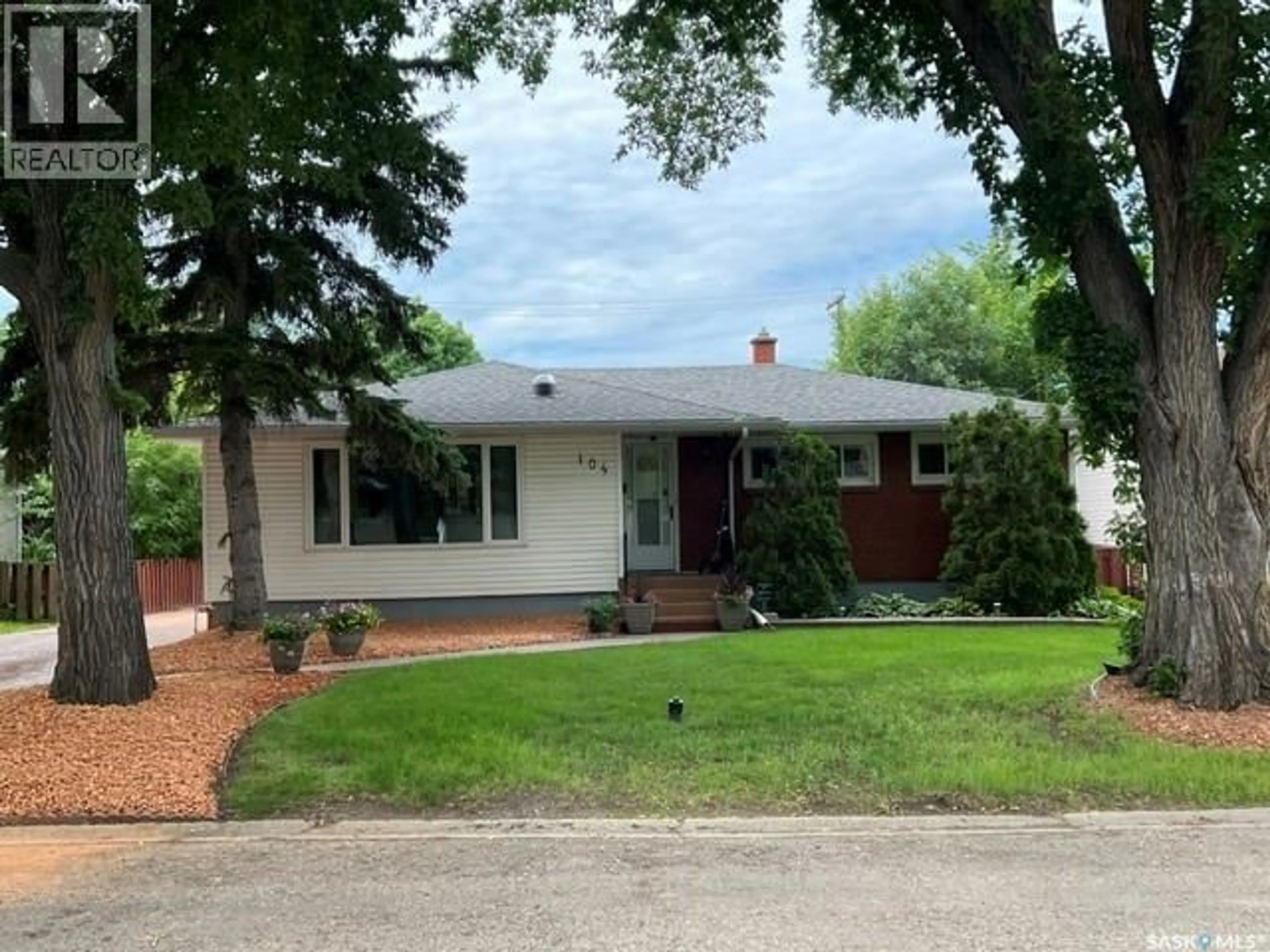 Home with brick exterior material, street for 104 MARSH CRESCENT, Regina Saskatchewan S4S6B4