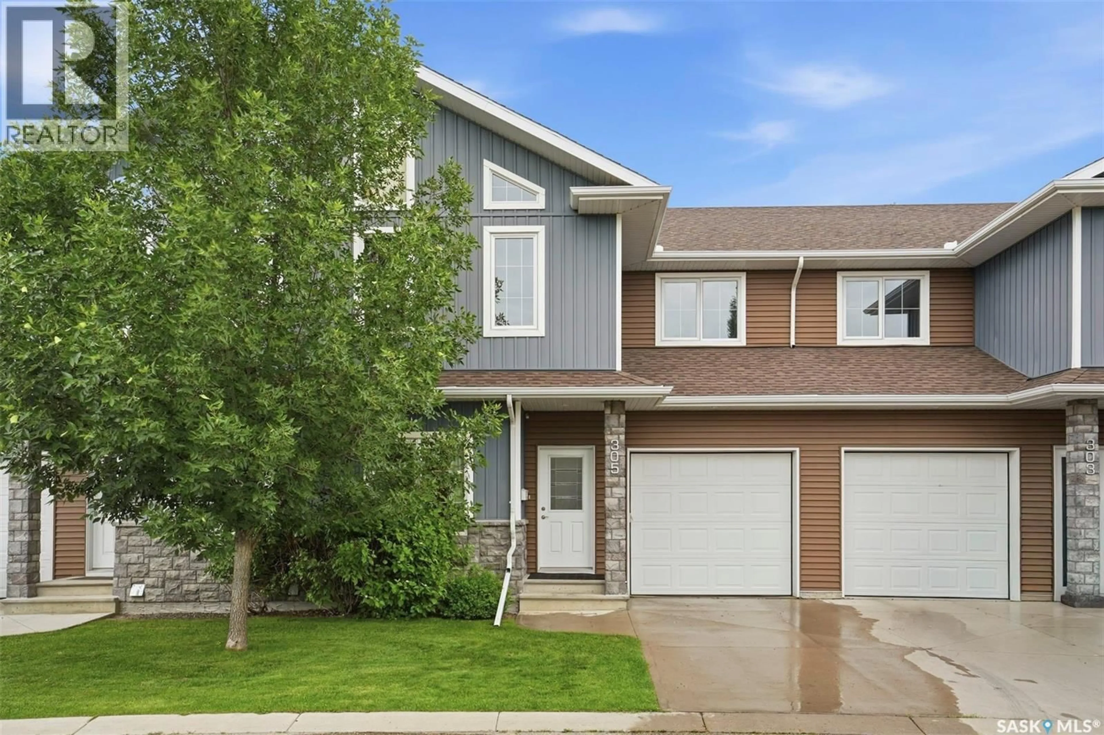 Home with vinyl exterior material, street for 315 - 305 ZARY ROAD, Saskatoon Saskatchewan S7W0N9