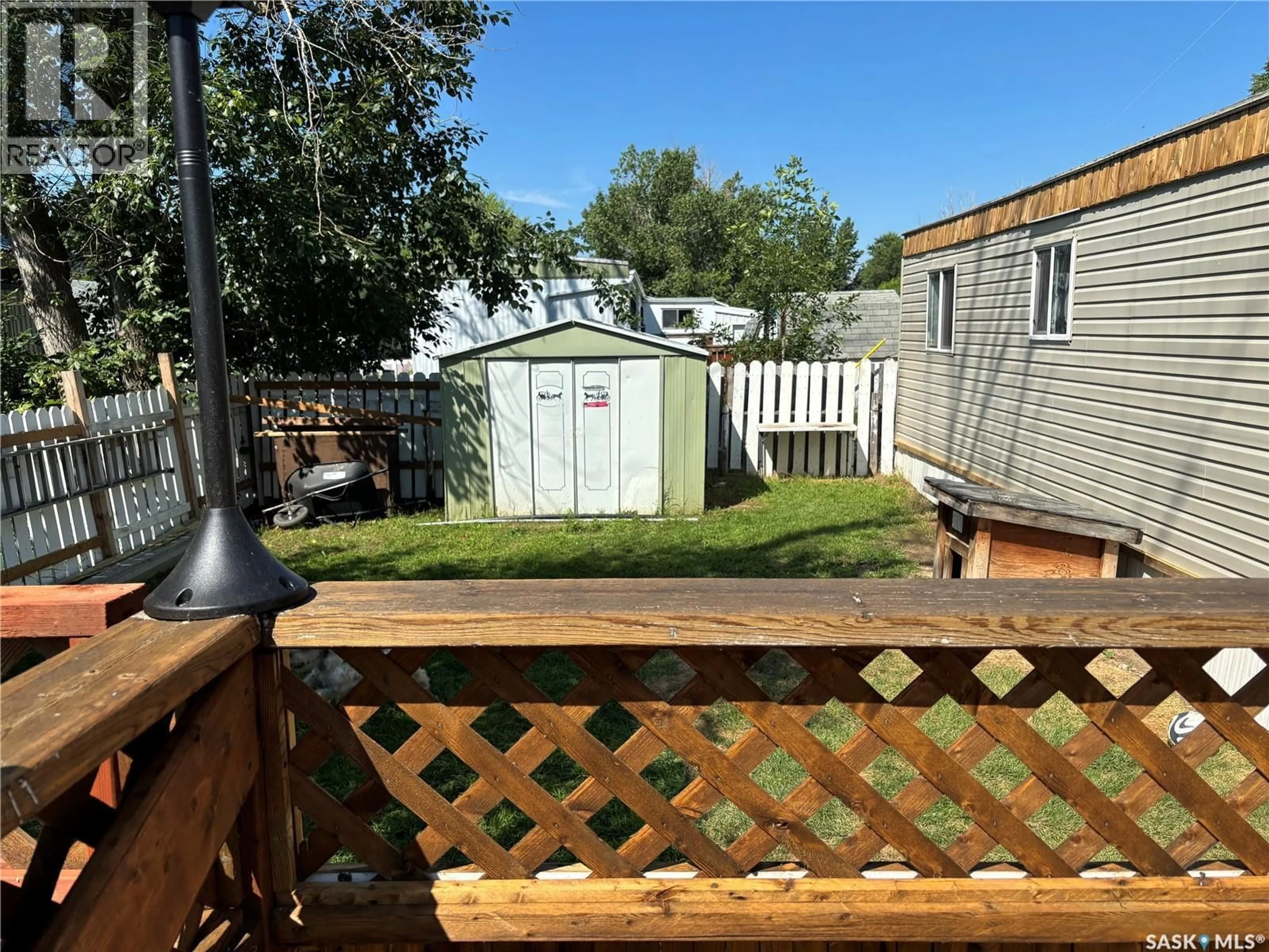 A pic from outside/outdoor area/front of a property/back of a property/a pic from drone, unknown for C2 - 1455 9TH AVENUE, Moose Jaw Saskatchewan S6J1C6