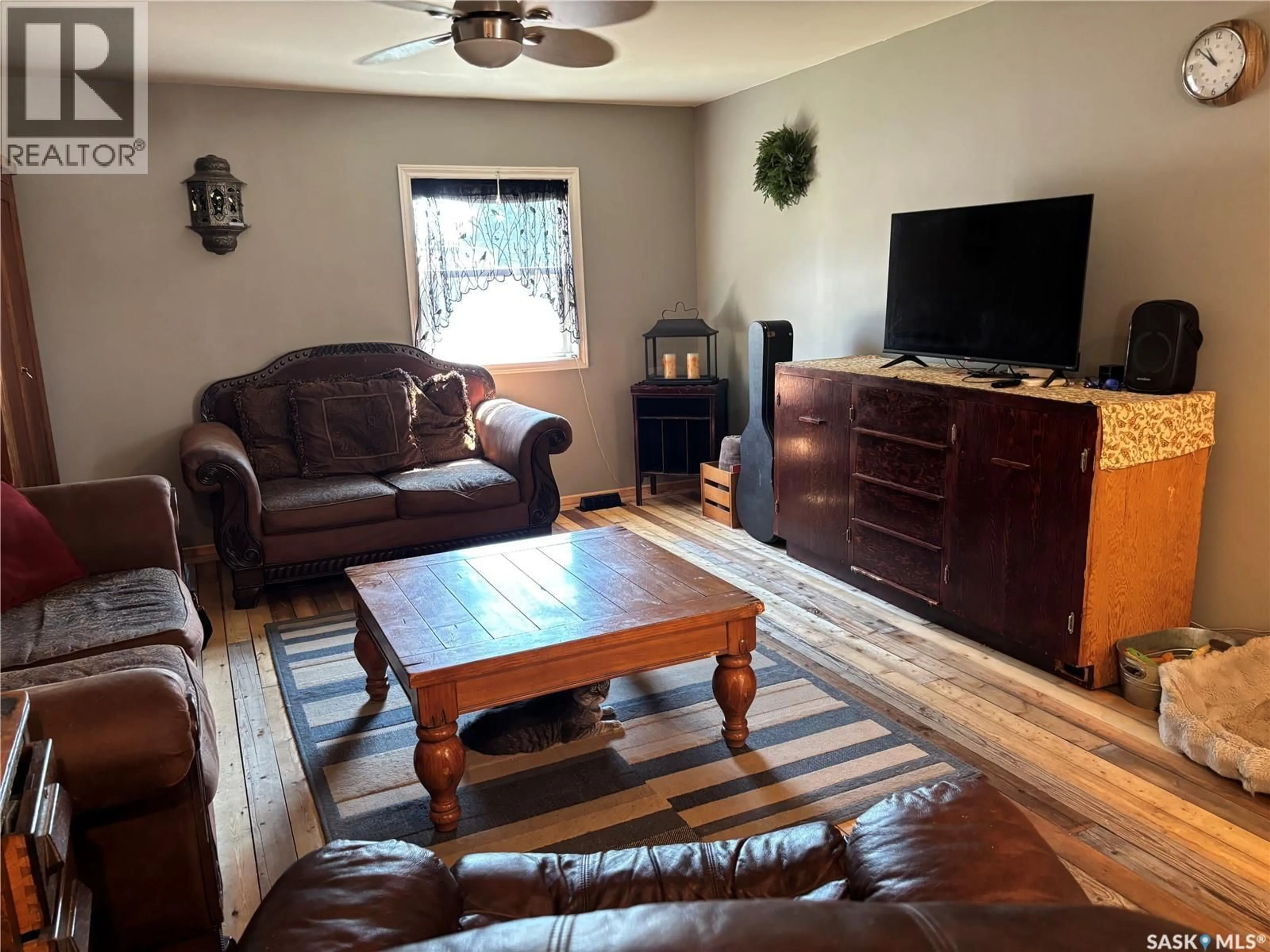 Living room with furniture, wood/laminate floor for C2 - 1455 9TH AVENUE, Moose Jaw Saskatchewan S6J1C6
