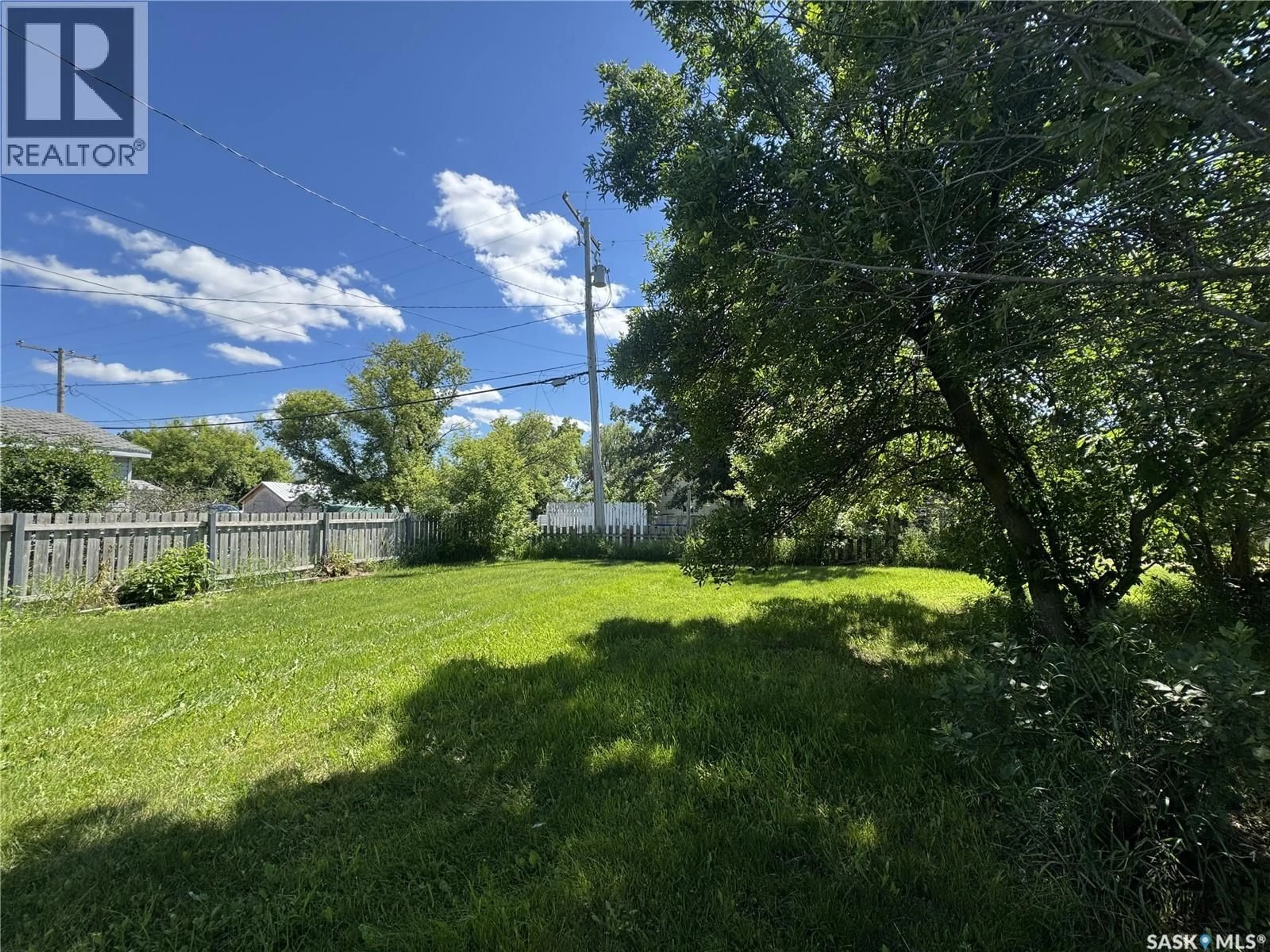 A pic from outside/outdoor area/front of a property/back of a property/a pic from drone, water/lake/river/ocean view for 106 5TH AVENUE E, Biggar Saskatchewan S0K0M0