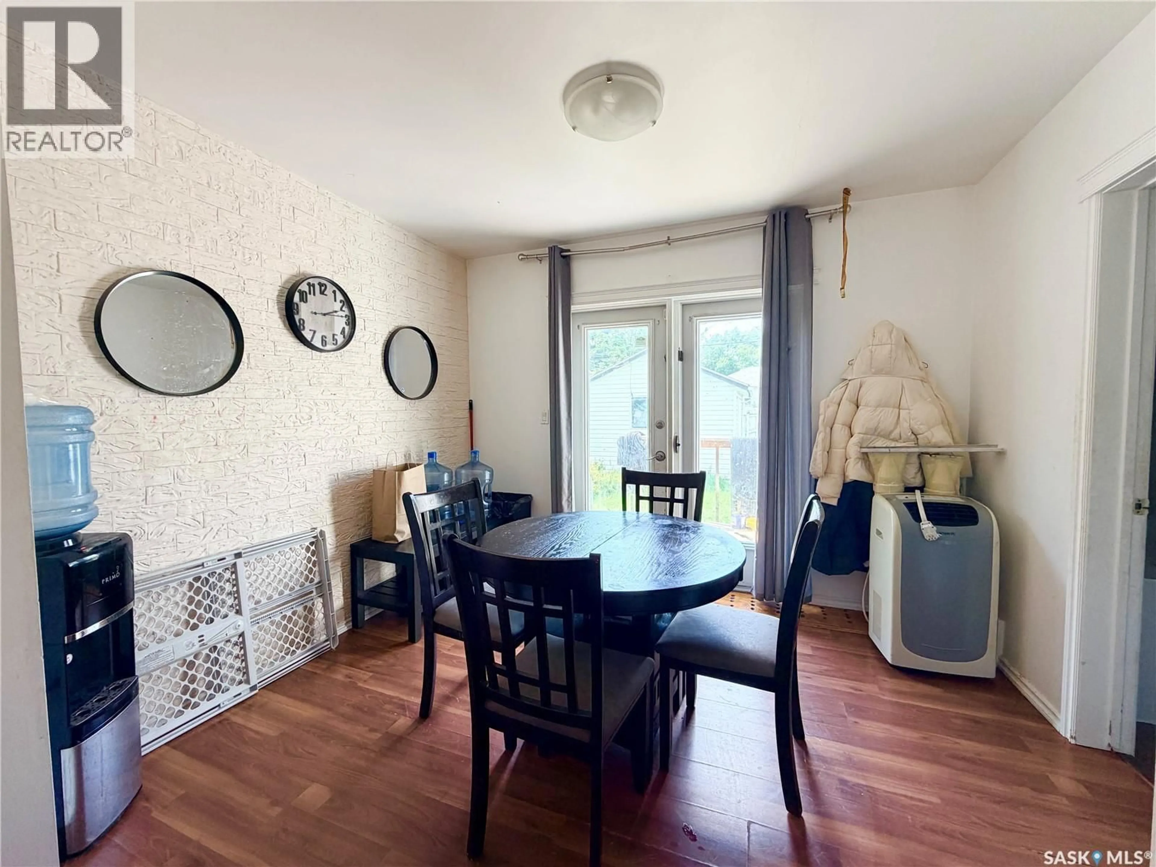 Dining room, wood/laminate floor for 971 109TH STREET, North Battleford Saskatchewan S9A2E1
