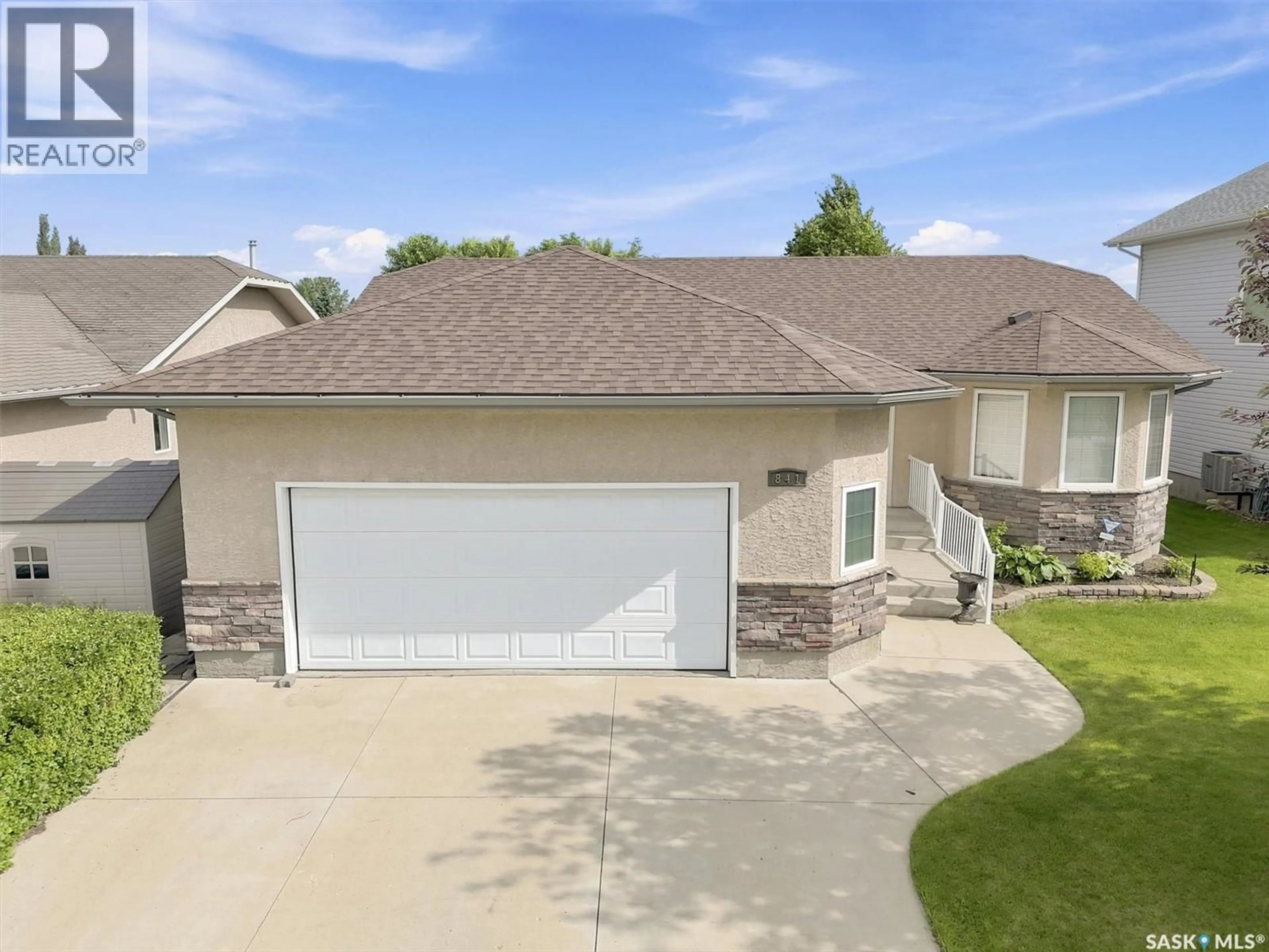 Home with vinyl exterior material, street for 841 MARTENS CRESCENT, Martensville Saskatchewan S0K2A0