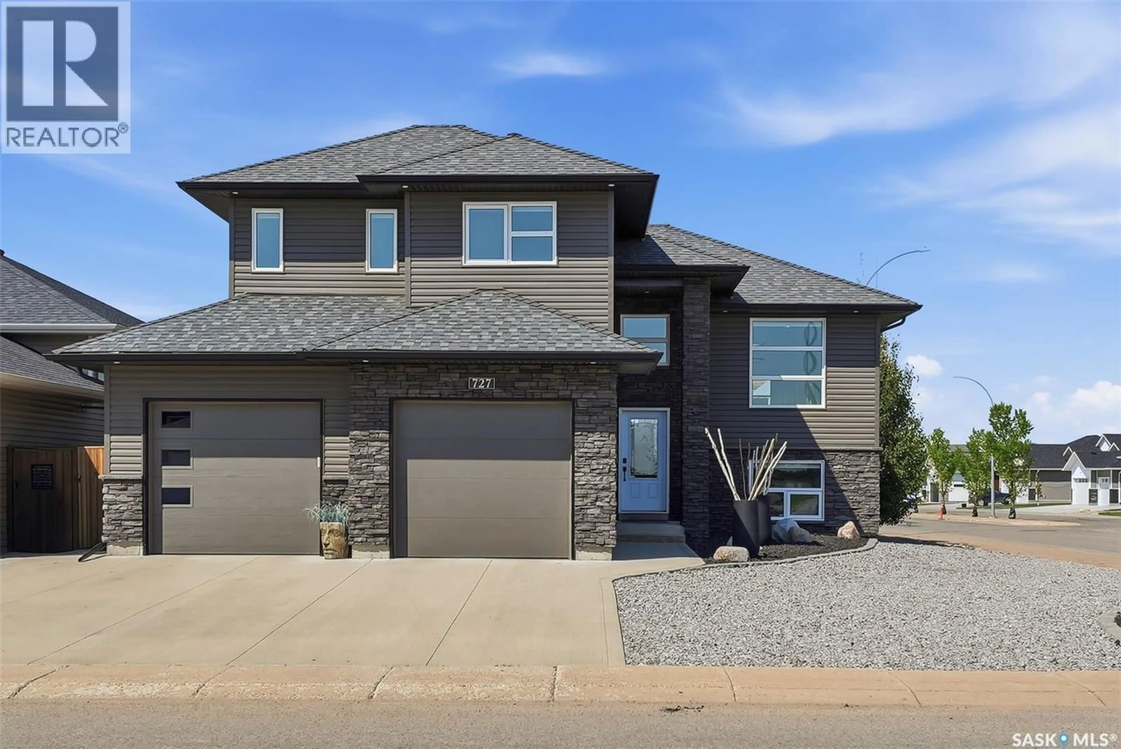 Home with brick exterior material, street for 727 1ST AVENUE, Warman Saskatchewan S0K4S2