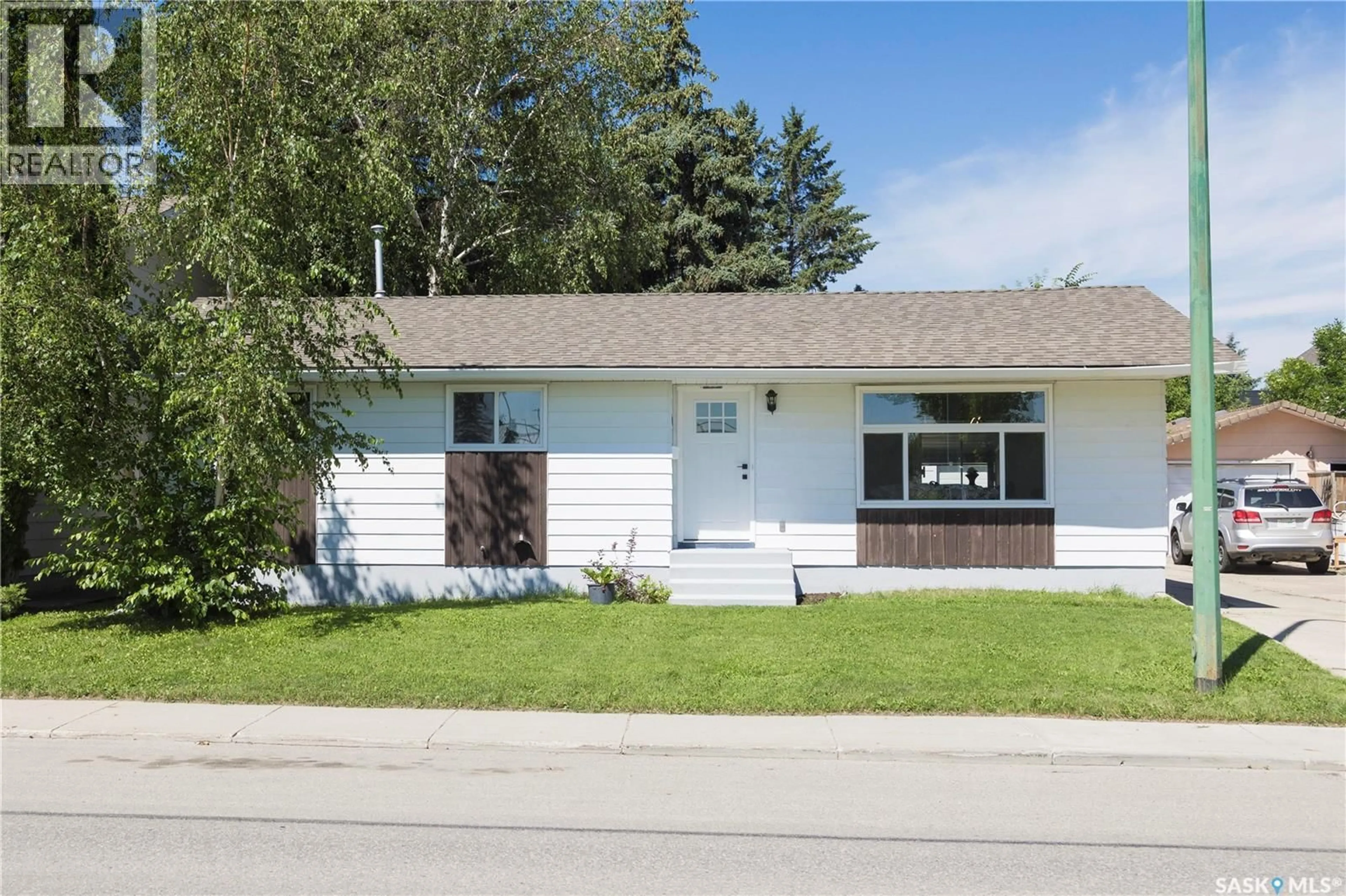 Home with vinyl exterior material, street for 1614 MCKERCHER DRIVE, Saskatoon Saskatchewan S7H5E1
