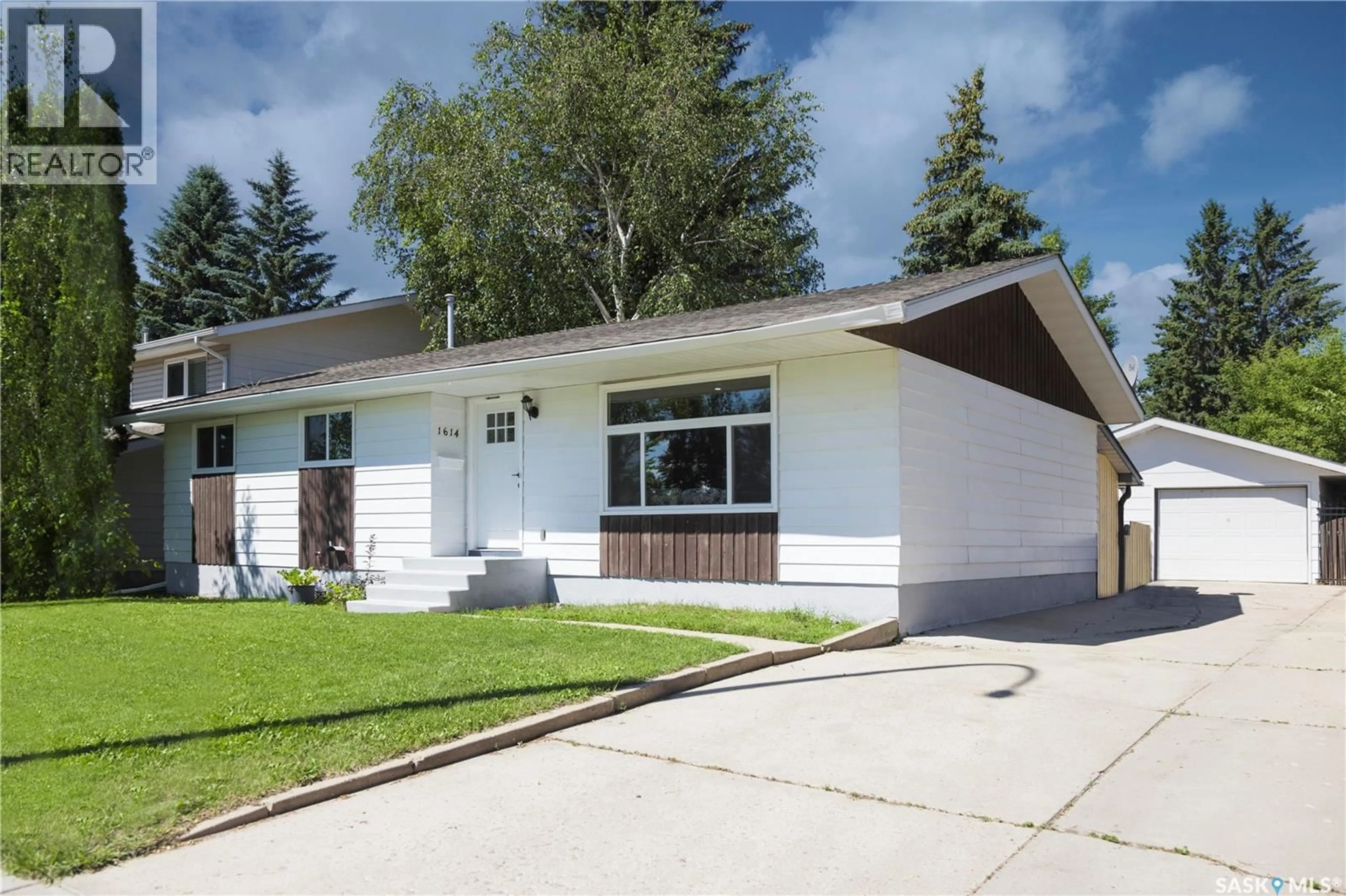 Home with vinyl exterior material, street for 1614 MCKERCHER DRIVE, Saskatoon Saskatchewan S7H5E1