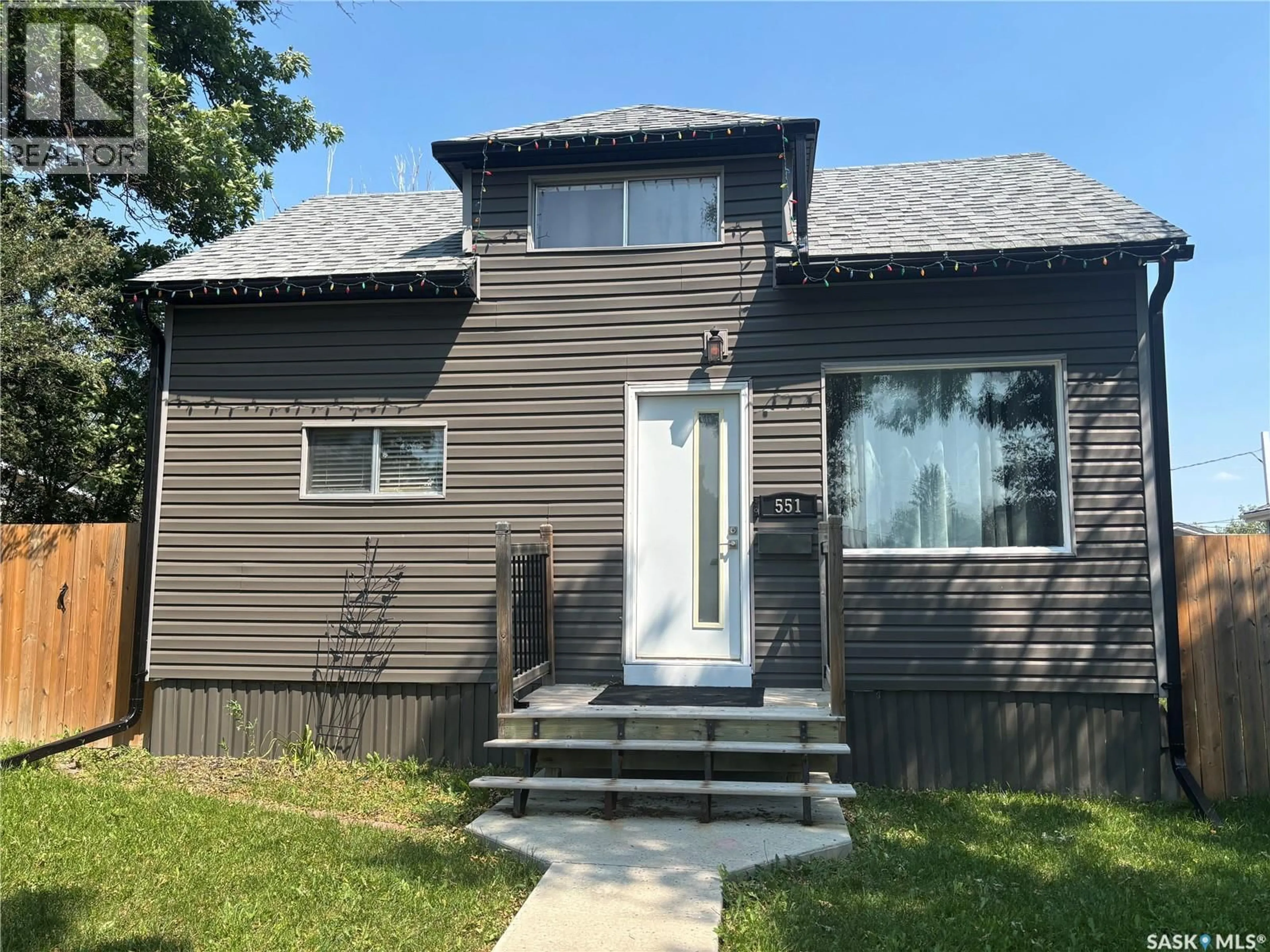 Home with vinyl exterior material, street for 551 2ND AVENUE, Swift Current Saskatchewan S9H0R1