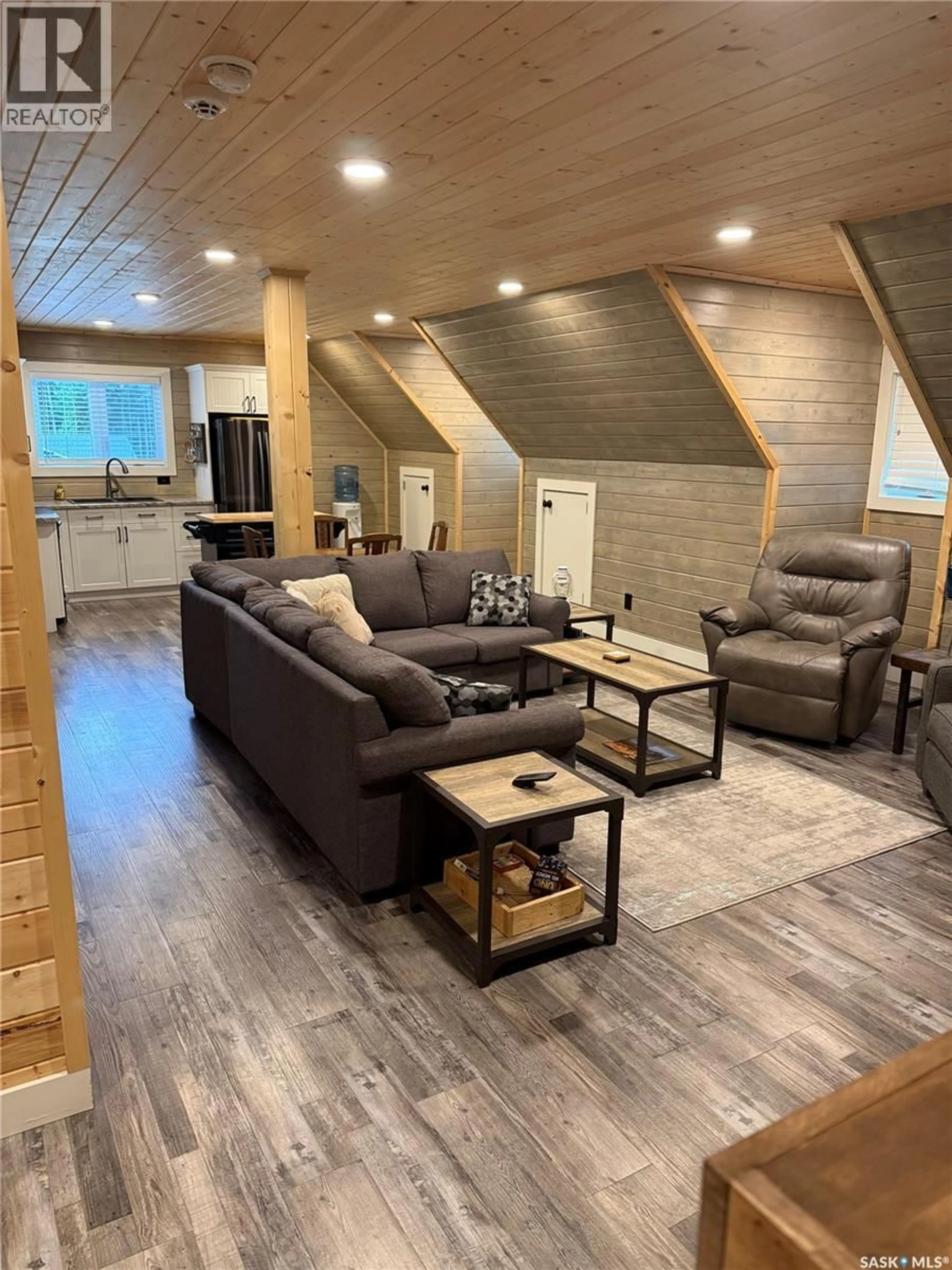 Living room with furniture, wood/laminate floor for 203 MCCALLUM STREET, Green Lake Saskatchewan S0M1B0