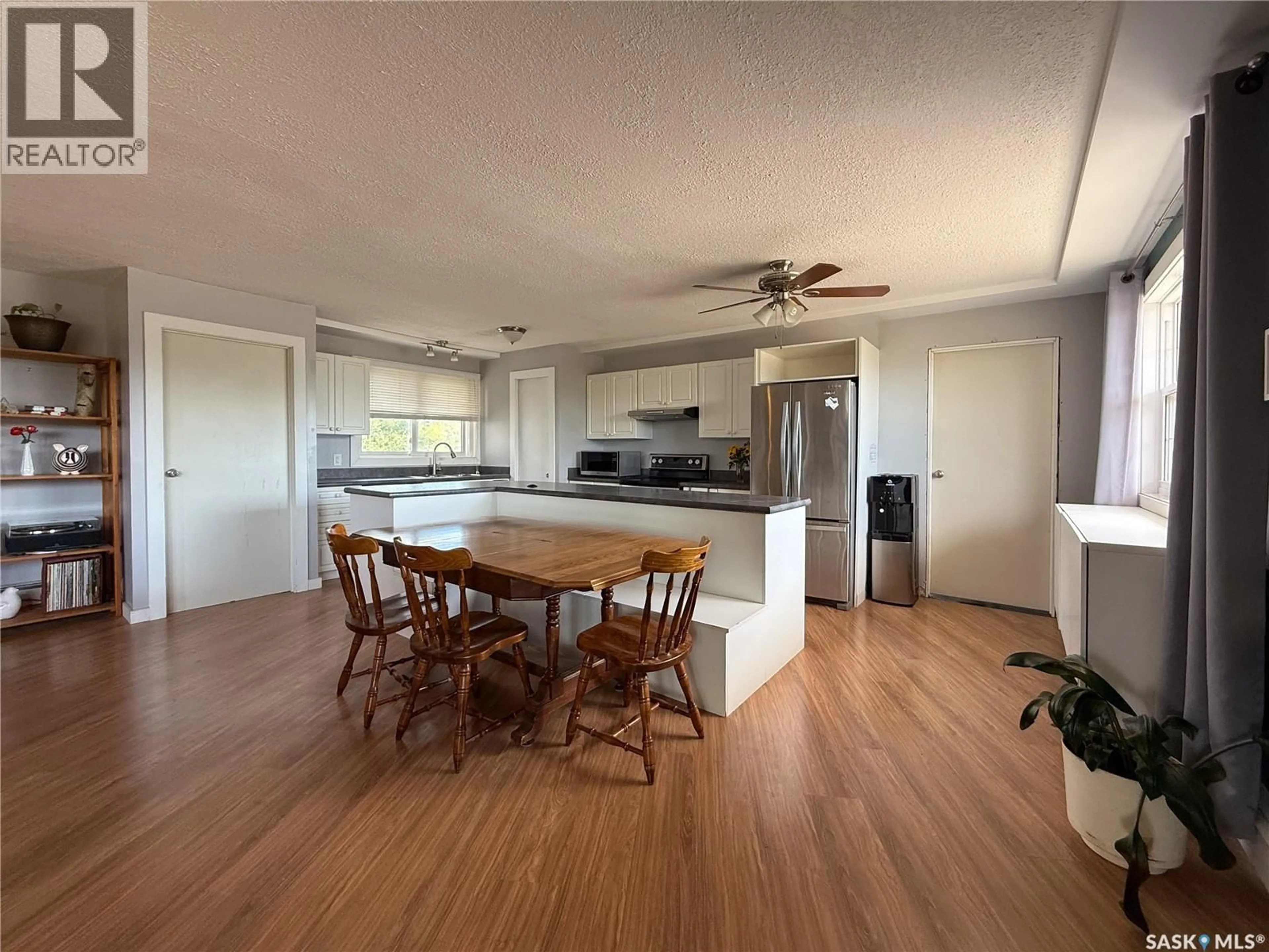 Open concept kitchen, wood/laminate floor for 223 2ND AVENUE, Frontier Saskatchewan S0N0W0