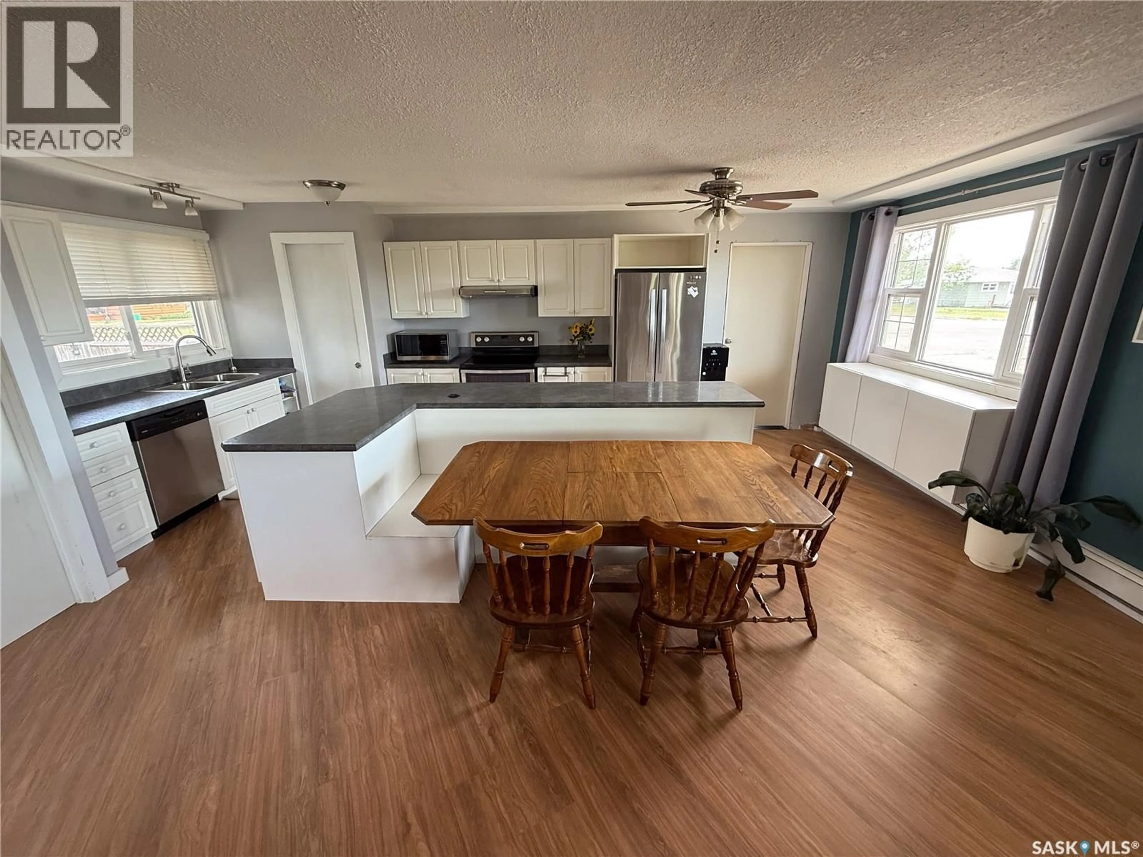 Open concept kitchen, wood/laminate floor for 223 2ND AVENUE, Frontier Saskatchewan S0N0W0