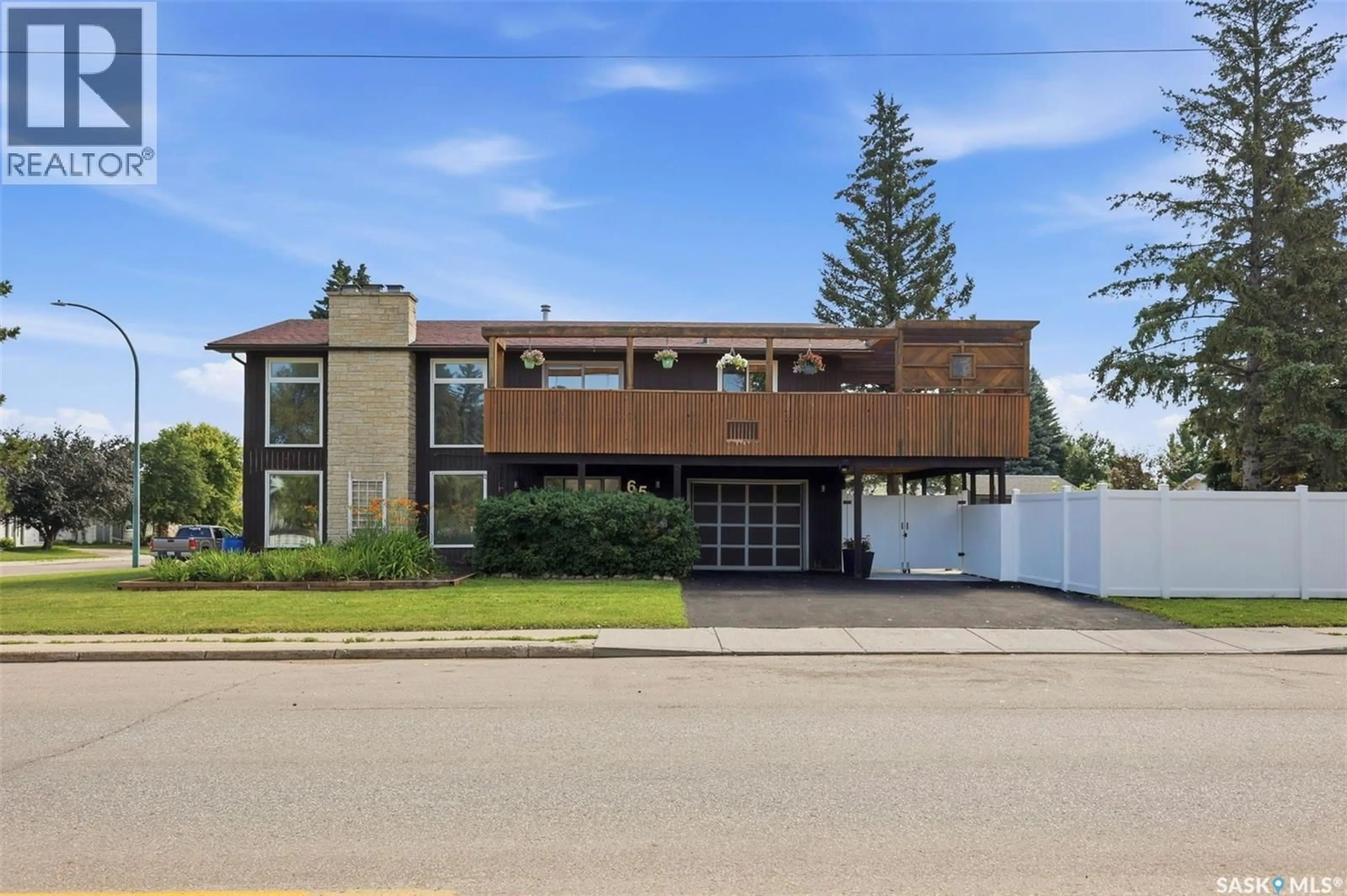 Home with brick exterior material, street for 65 RENNIE PLACE, Saskatoon Saskatchewan S7H4N8
