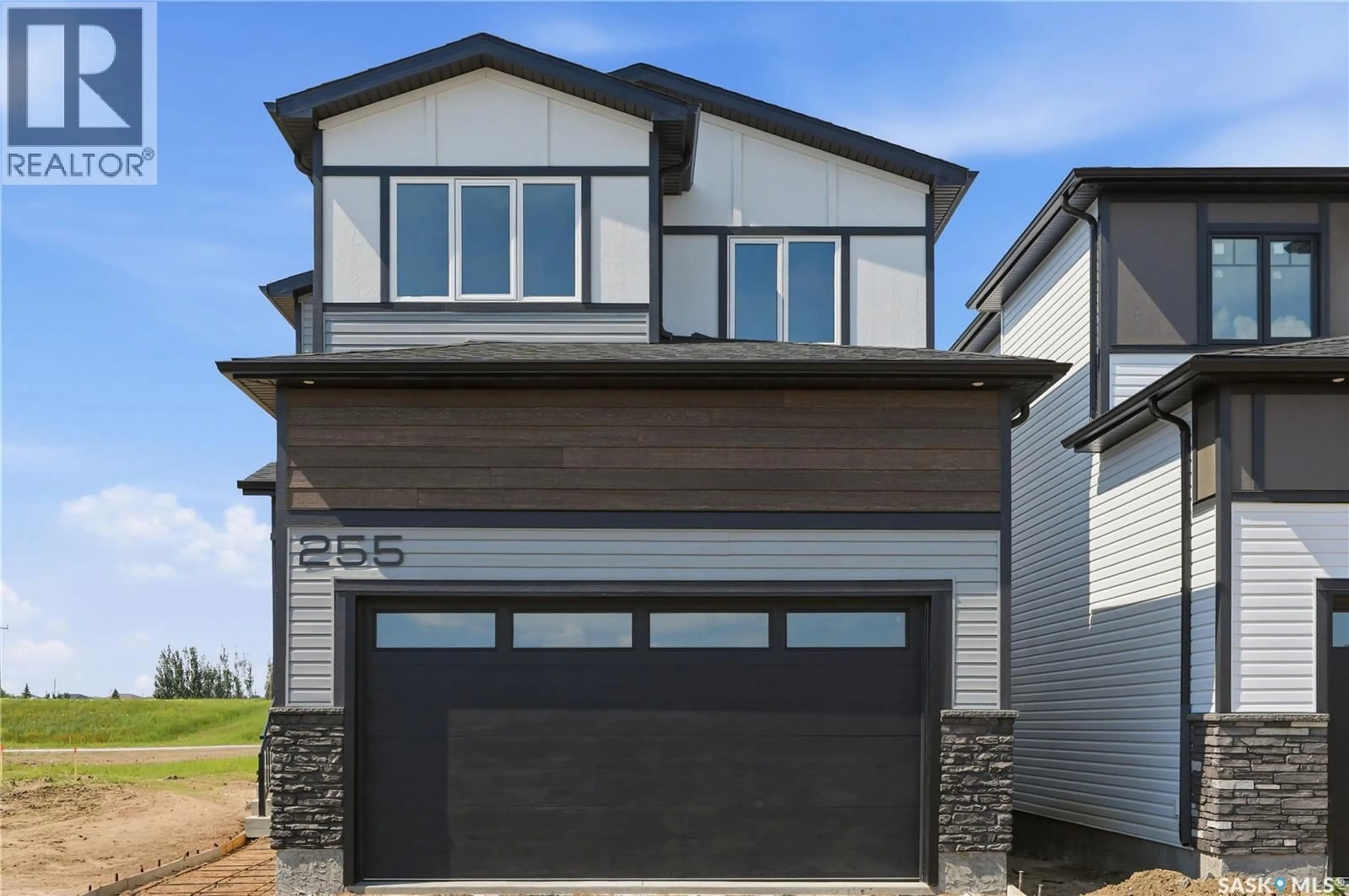 Home with vinyl exterior material, street for 255 DORAN WAY, Saskatoon Saskatchewan S7V1Z3