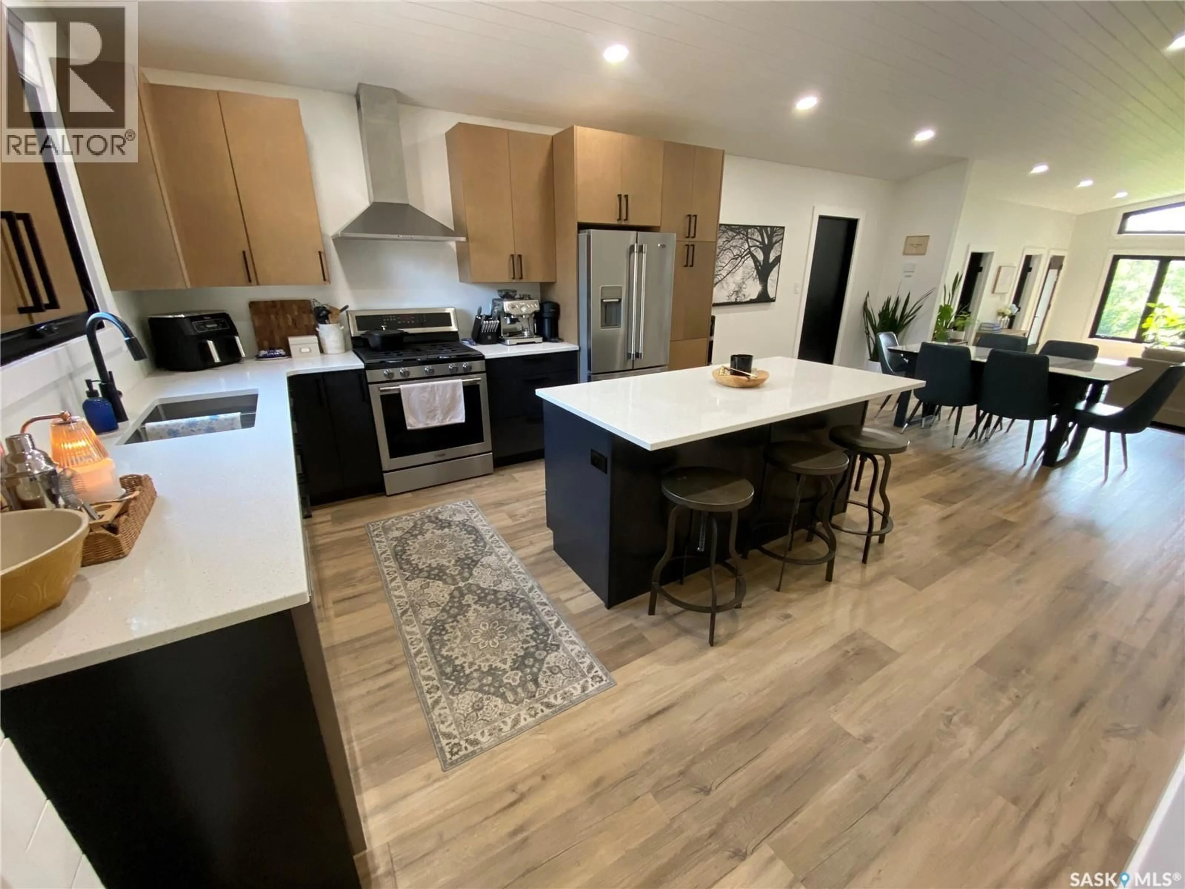 Open concept kitchen, wood/laminate floor for 407 CAPALANO DRIVE, Good Spirit Lake Saskatchewan S0A0L1