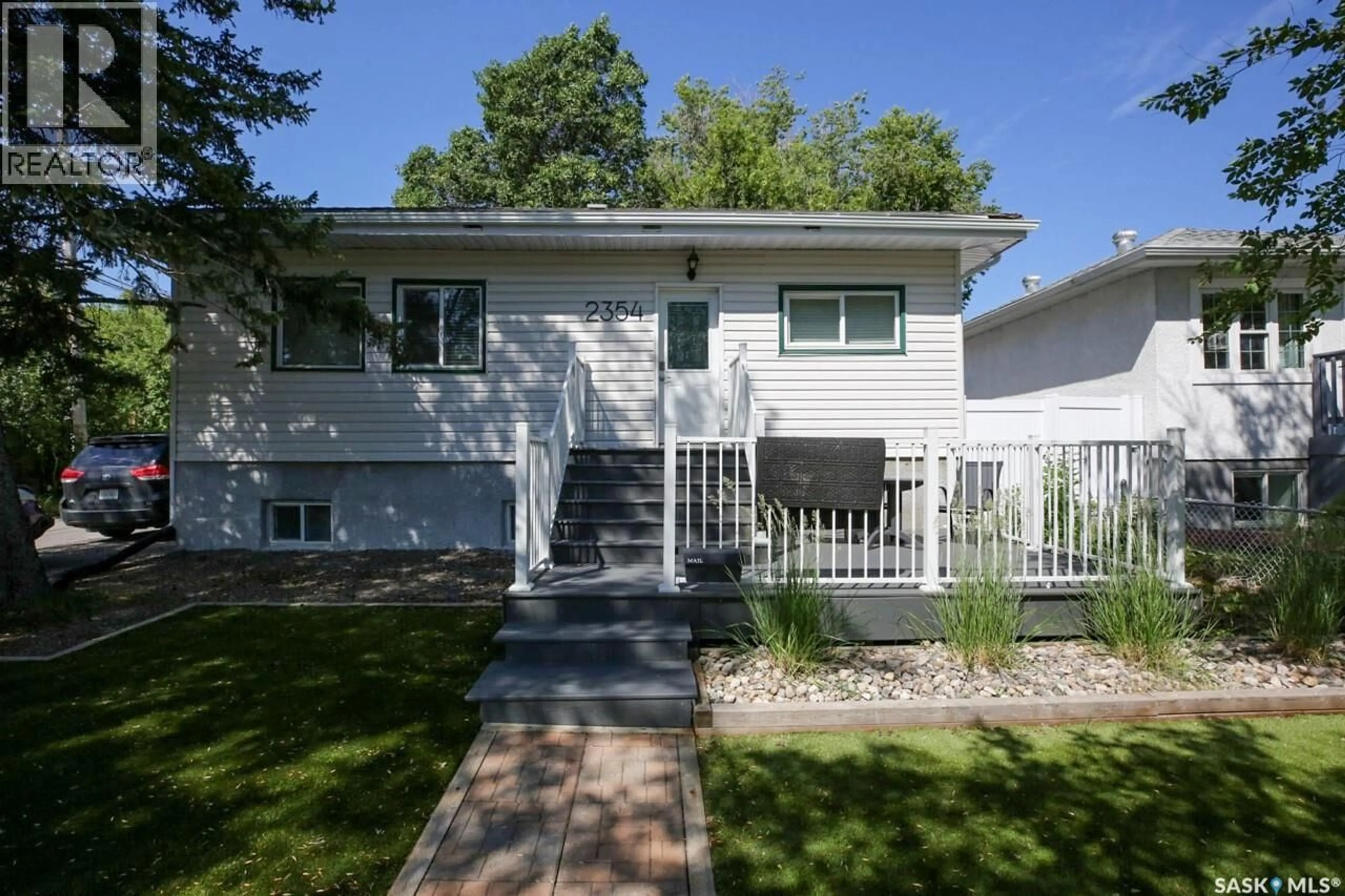 Home with vinyl exterior material, street for 2354 MCARA STREET, Regina Saskatchewan S4N2W3