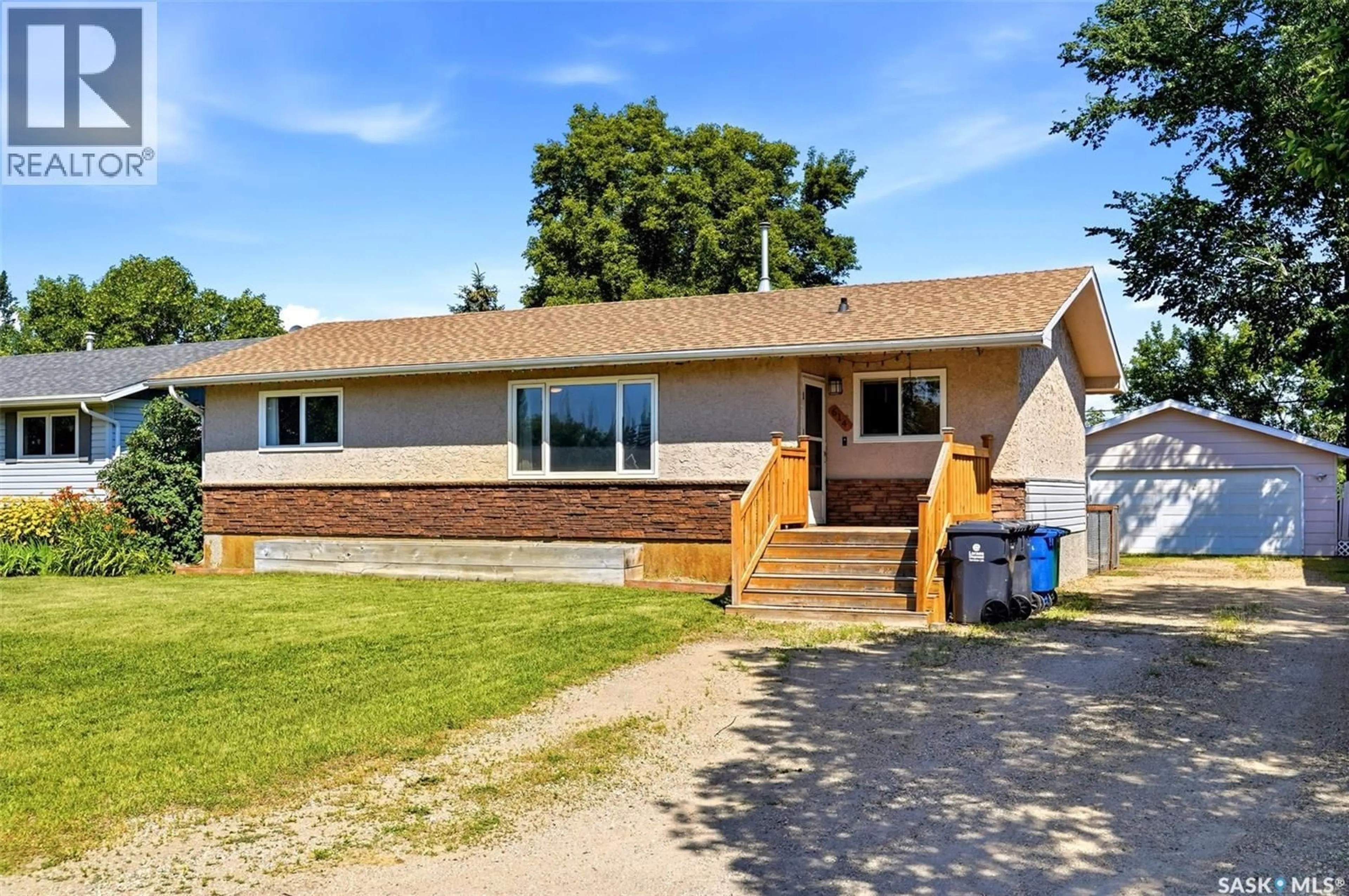 Home with vinyl exterior material, street for 614 3RD AVENUE, Pilot Butte Saskatchewan S0G3Z0
