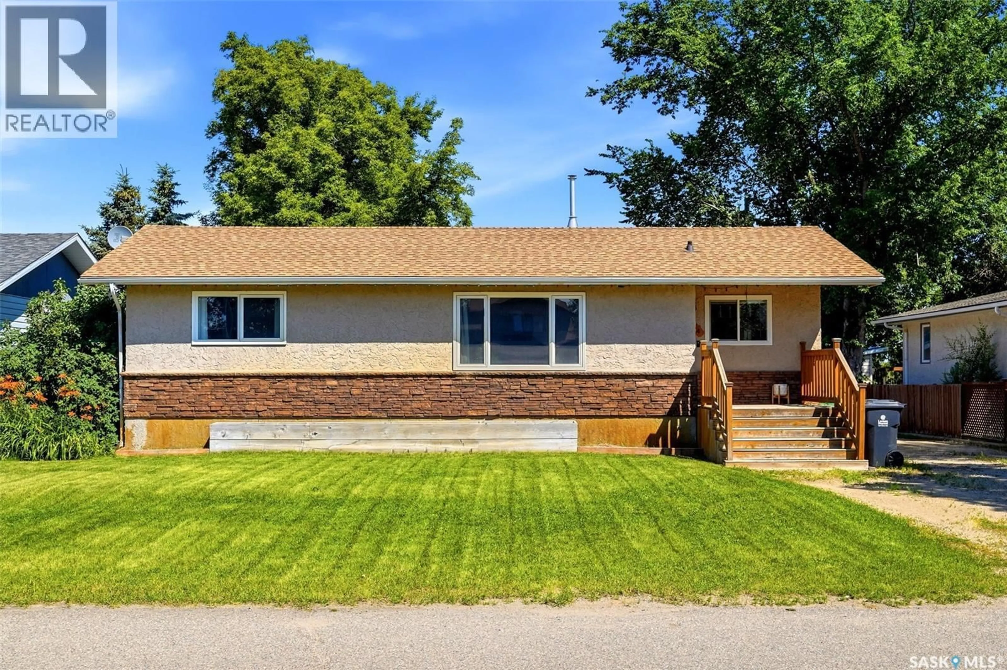 Home with vinyl exterior material, street for 614 3RD AVENUE, Pilot Butte Saskatchewan S0G3Z0