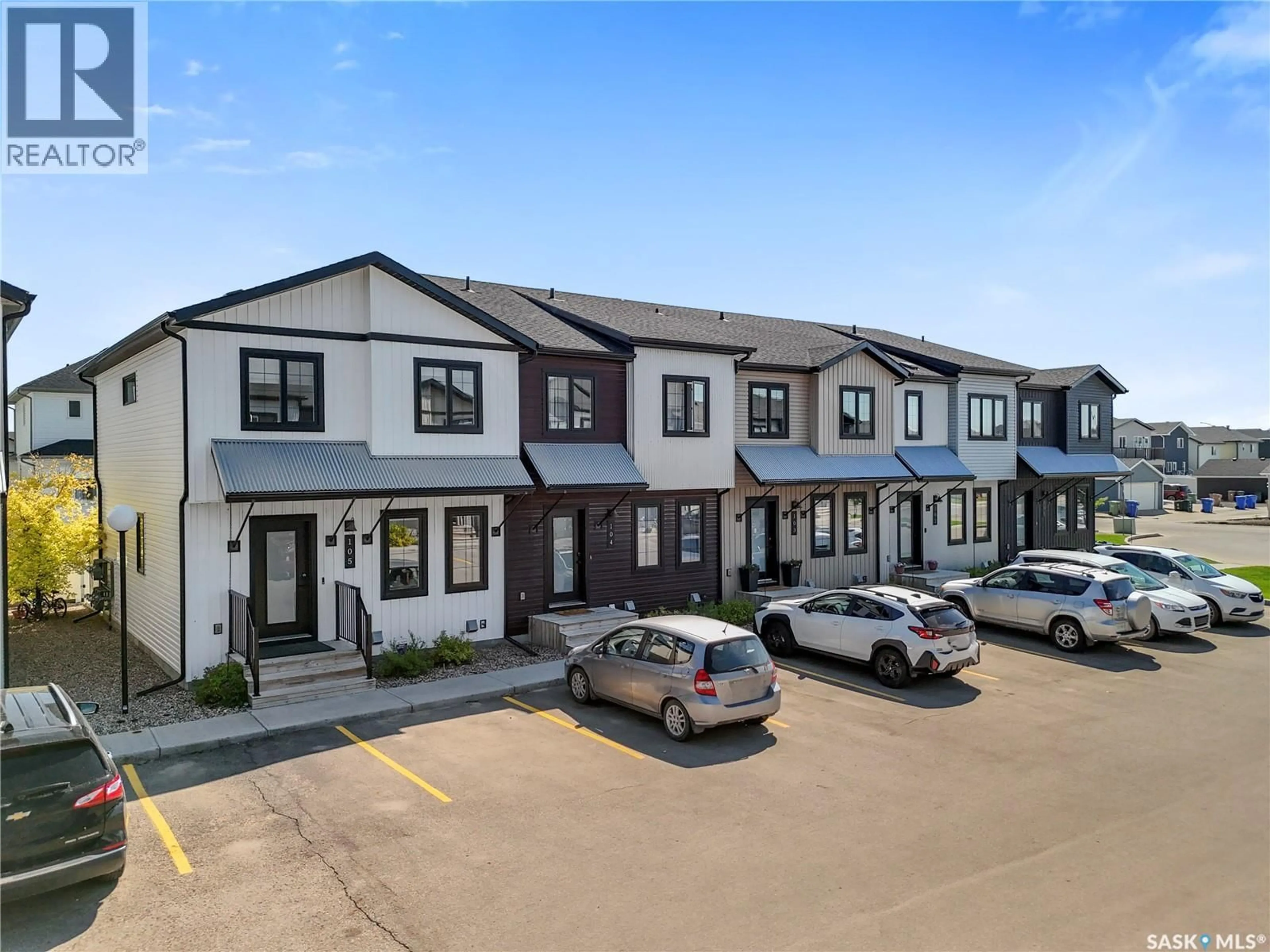 A pic from outside/outdoor area/front of a property/back of a property/a pic from drone, street for 105 - 2715 NARCISSE DRIVE, Regina Saskatchewan S4X0P8