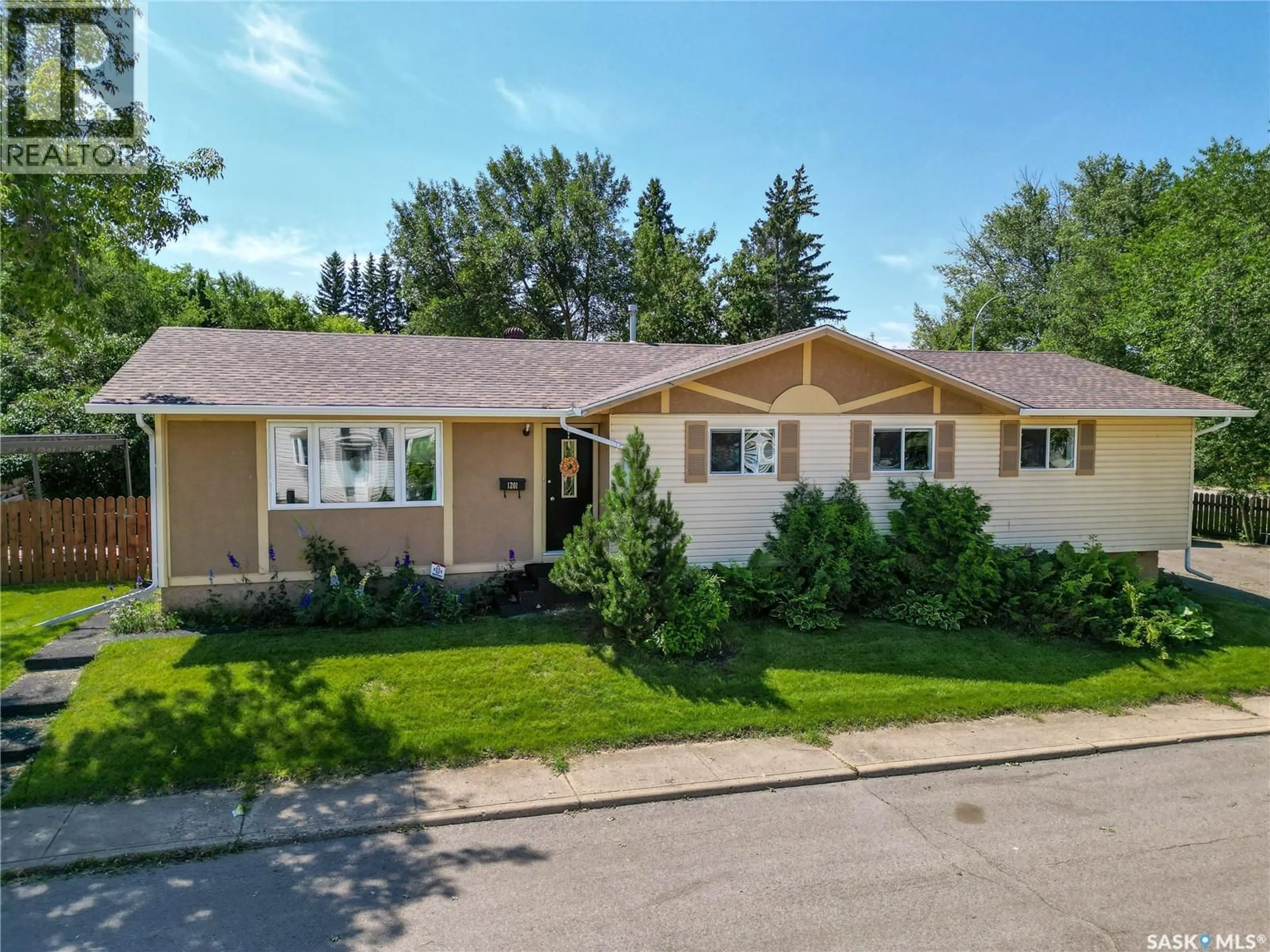 Home with vinyl exterior material, street for 1201 MCKAY DRIVE, Prince Albert Saskatchewan S6V5V1